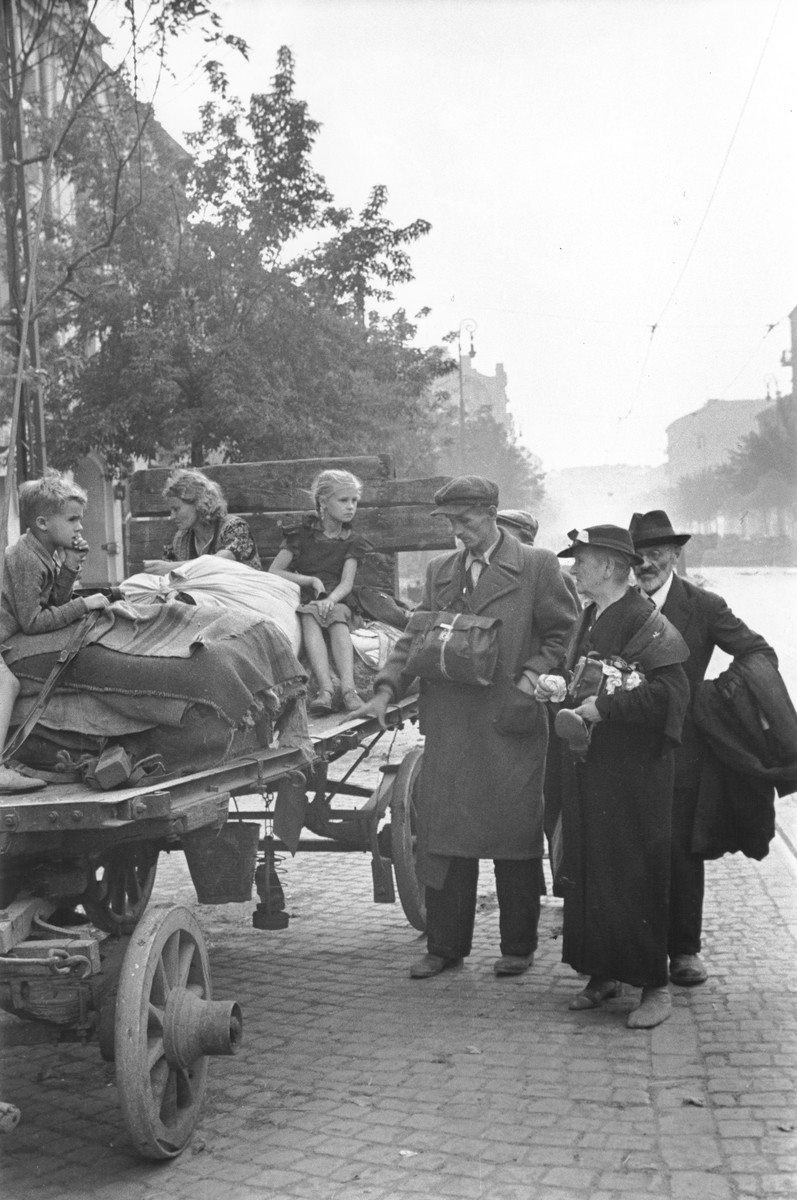 A family of Polish peasant refugees arrive in Warsaw on a horse-drawn wagon during the siege of the capital.