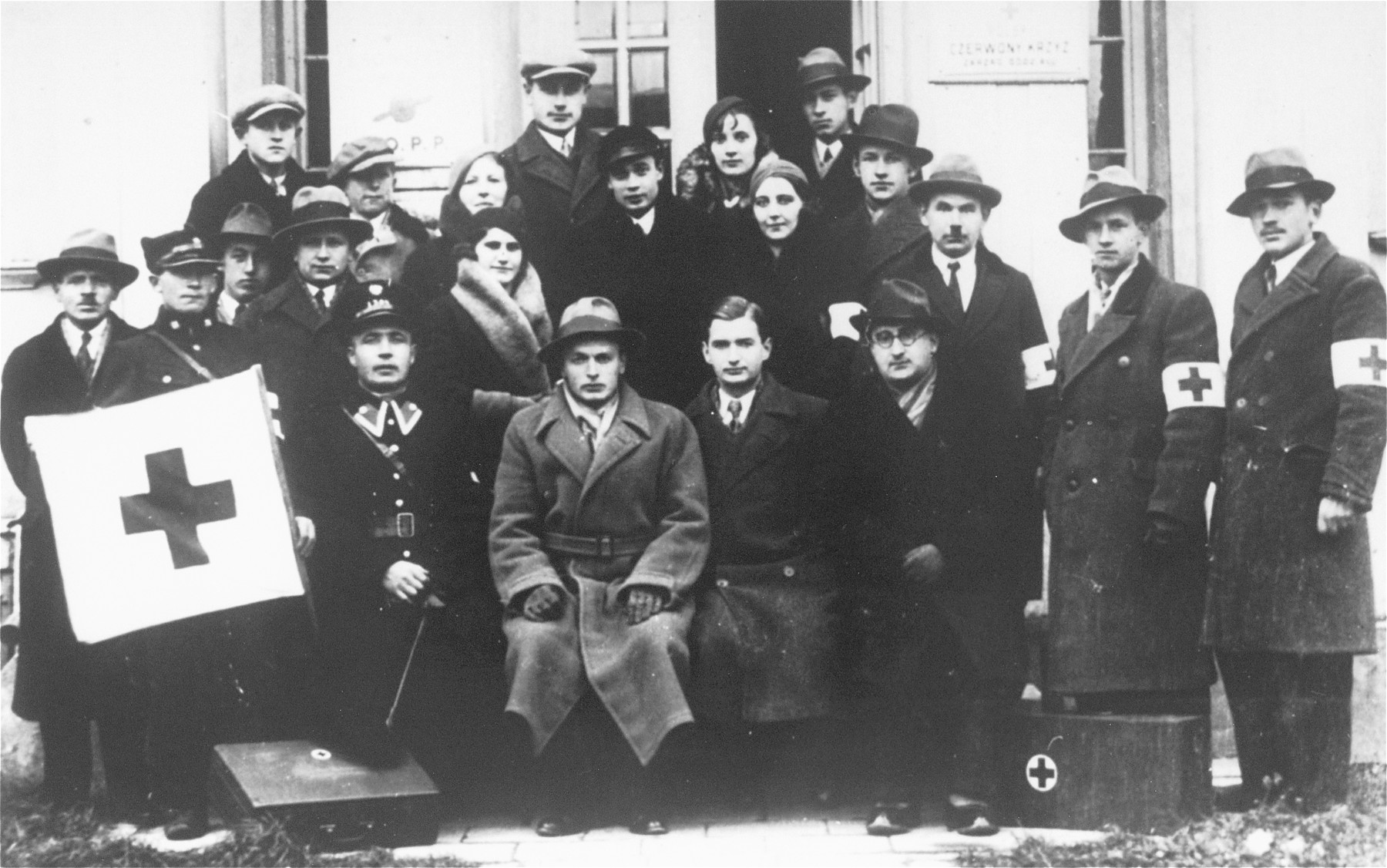 Group portrait of members of the Polish Red Cross, among them one Jew, Dr. Marek Marienstrauss, sitting on the far right.
