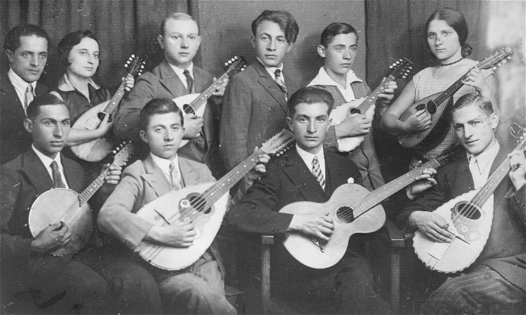 Group portrait of the members of a Jewish youth orchestra.

In the second row: second from left is Fela Kamionkowska Kiwajko and first from right is Hana Kamionkowska Bromberg.  Both were cousins of donor's late husband, Joseph Steinberg.