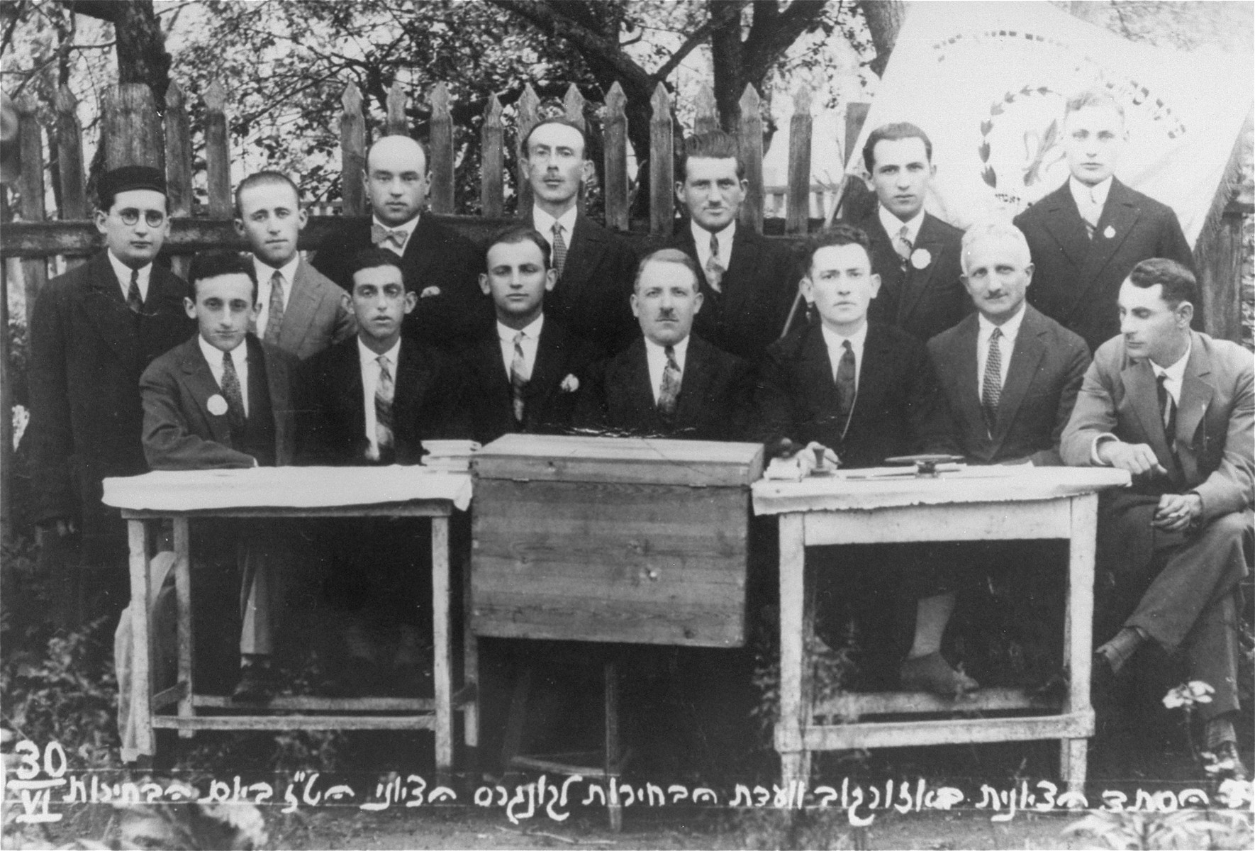 Group portrait of members of the Ozorkow election committee for the 16th Zionist Congress. 

Among those pictured are: Mayer Zabner, the donor's uncle (front row, second from the right), Mr. Feldman (front row, right), Mr. Winter (front row, center), Mr. Rosenblum (front row, left).