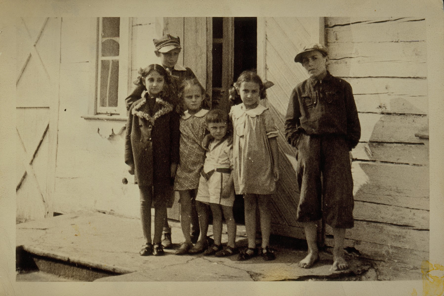Group portrait of children in front of a private home in the town of Eisiskes.  The Jews of this shtetl  were murdered by the Einsatzgruppen on September 21, 1941.
