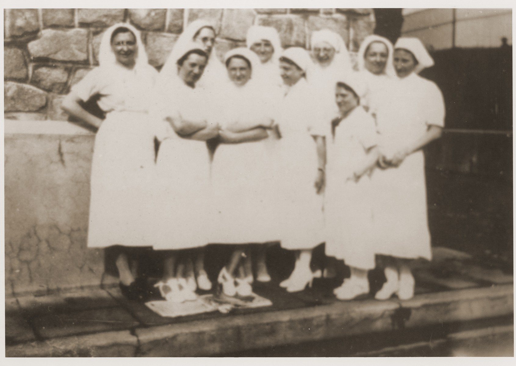 The team of nurses at the Recebedou camp. 

At the back in the middle is Mademoiselle Hentsch, next to her in glasses is Helene Guillemin-Tarayre (a lifelong friend of Isabelle Peloux, the aunt of Marie Genevieve Parmentier). At left, with her arms crossed, is Mademoiselle Rondespierre, who followed Isabelle to Recebedou.