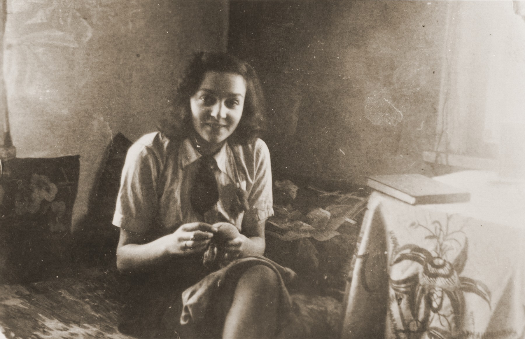 Portrait of Ida Karnovski sitting in her room in the Kovno ghetto.