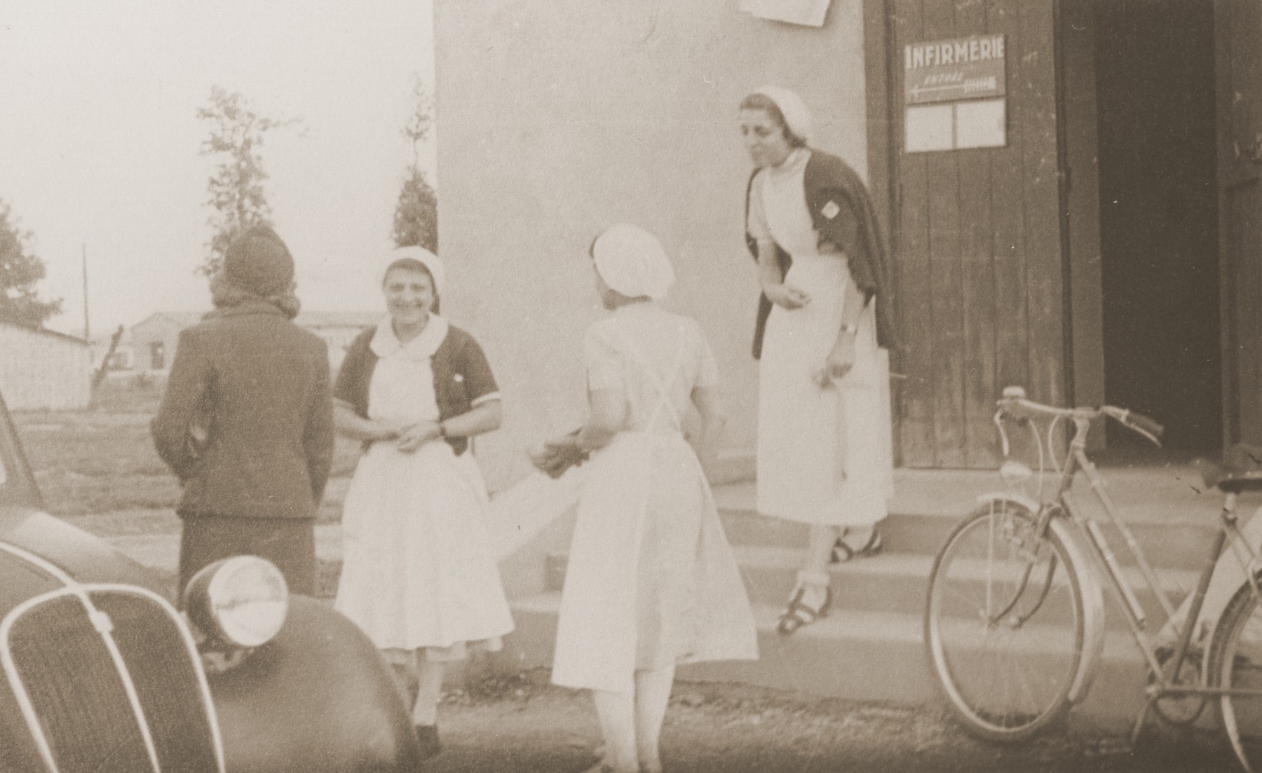 Nurses at the Recebedou camp infirmary. Second from the left is Isabelle Peloux, the aunt of Marie Genevieve Parmentier.

Marie Genevieve Parmentier was a ten year-old French girl living in Paris at the time of the German occupation in 1940. Her widowed mother sent her to safety with an old relative in Ariège in the South of France. She sooned joined her aunt, Isabelle Peloux, a military nurse, at the camp of Recebedou. While there she attended primary school at nearby Portet-sur-Garonne, before returning to her family in the summer of 1941.