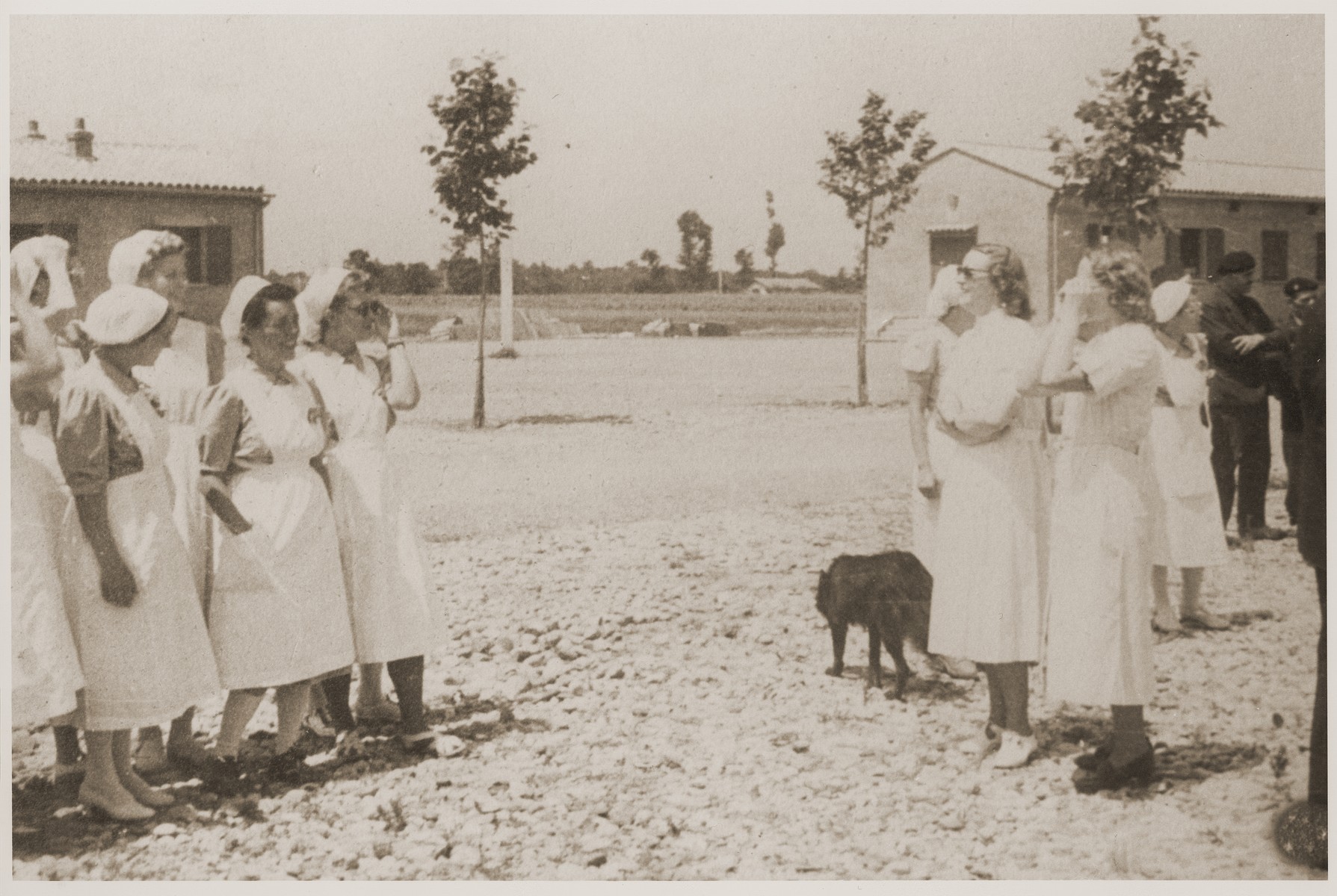 Some nurses gather outside on the grounds of the Recebedou camp.