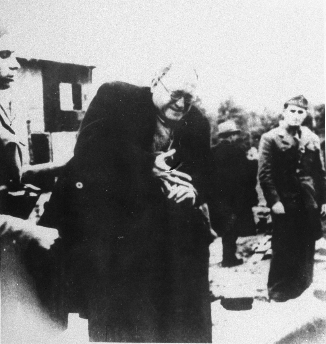 A Jewish prisoner is forced to remove his ring upon his arrival in the Jasenovac concentration camp.

Pictured is Teodore Grunfeld.