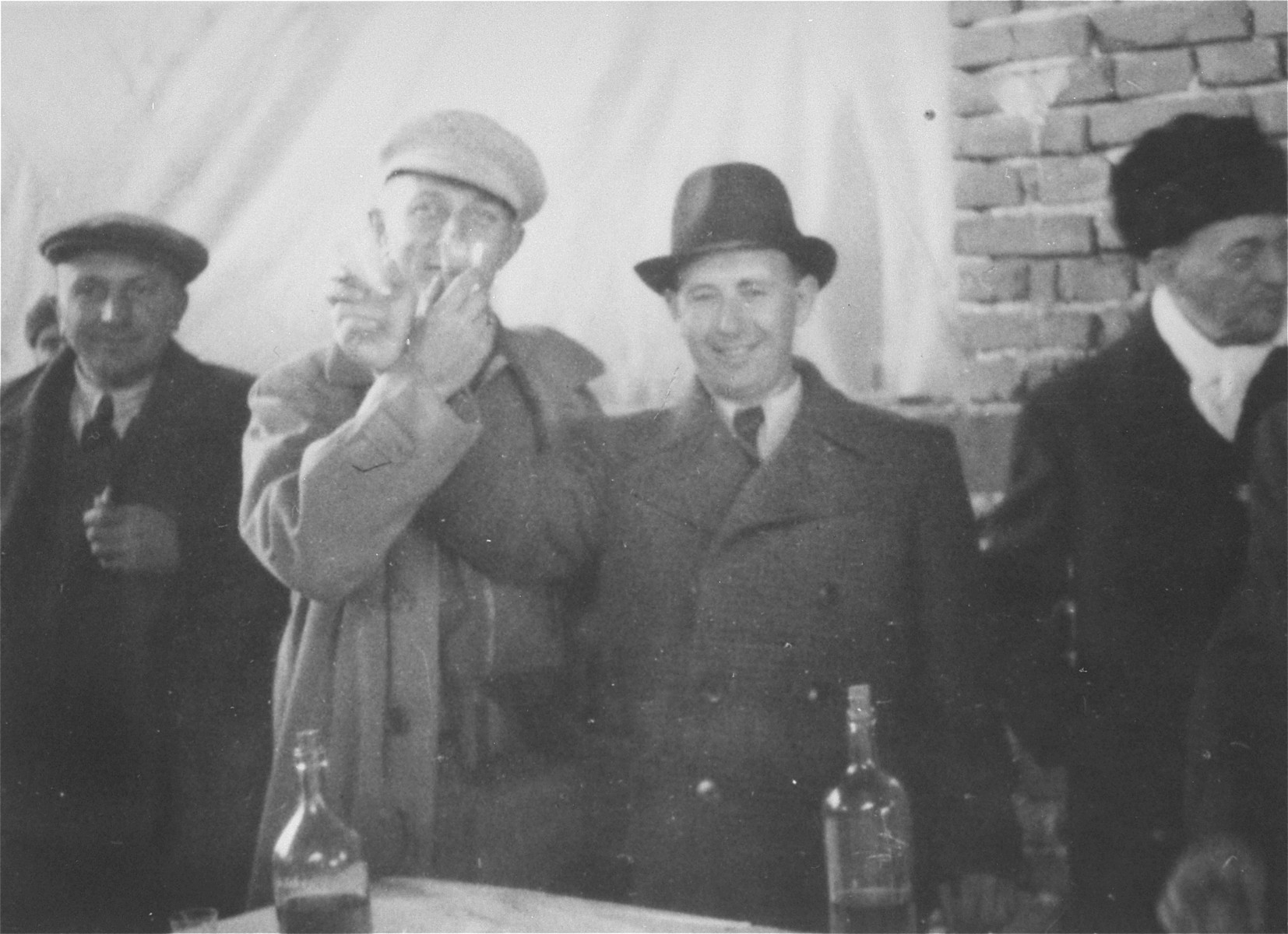 A group of men toast the opening of a new wood manufacturing factory in Gugesti, Romania.

Among those pictured is Beno Kupferman (second from the right).