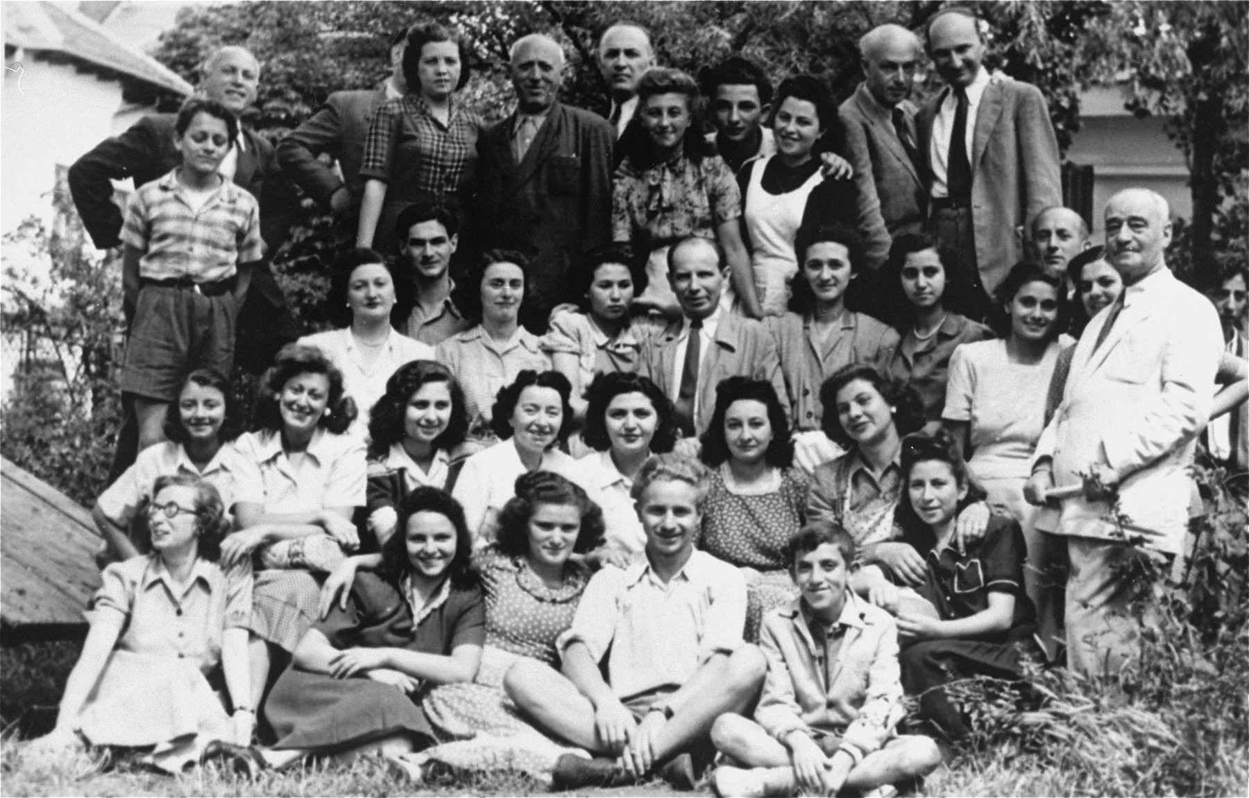 Group portrait of Jewish students attending a book-binding course in Bacau, Romania. 

Among those pictured is Jeanine Gutman (second row, third from the right).  This school was one of many organized by the Jewish community after Jewish youth were excluded from the Romanian school system.