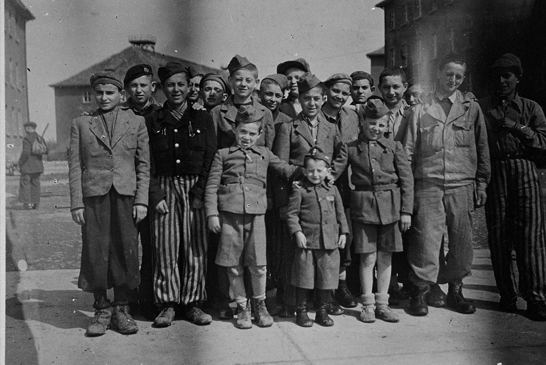 Group portrait of child survivors of Buchenwald.  

The young boy in the middle is Joseph Schleifstein.  Behind him is Abram Wroclawski, originally from Lodz who was sent to Auschwitz before coming to Buchenwald.