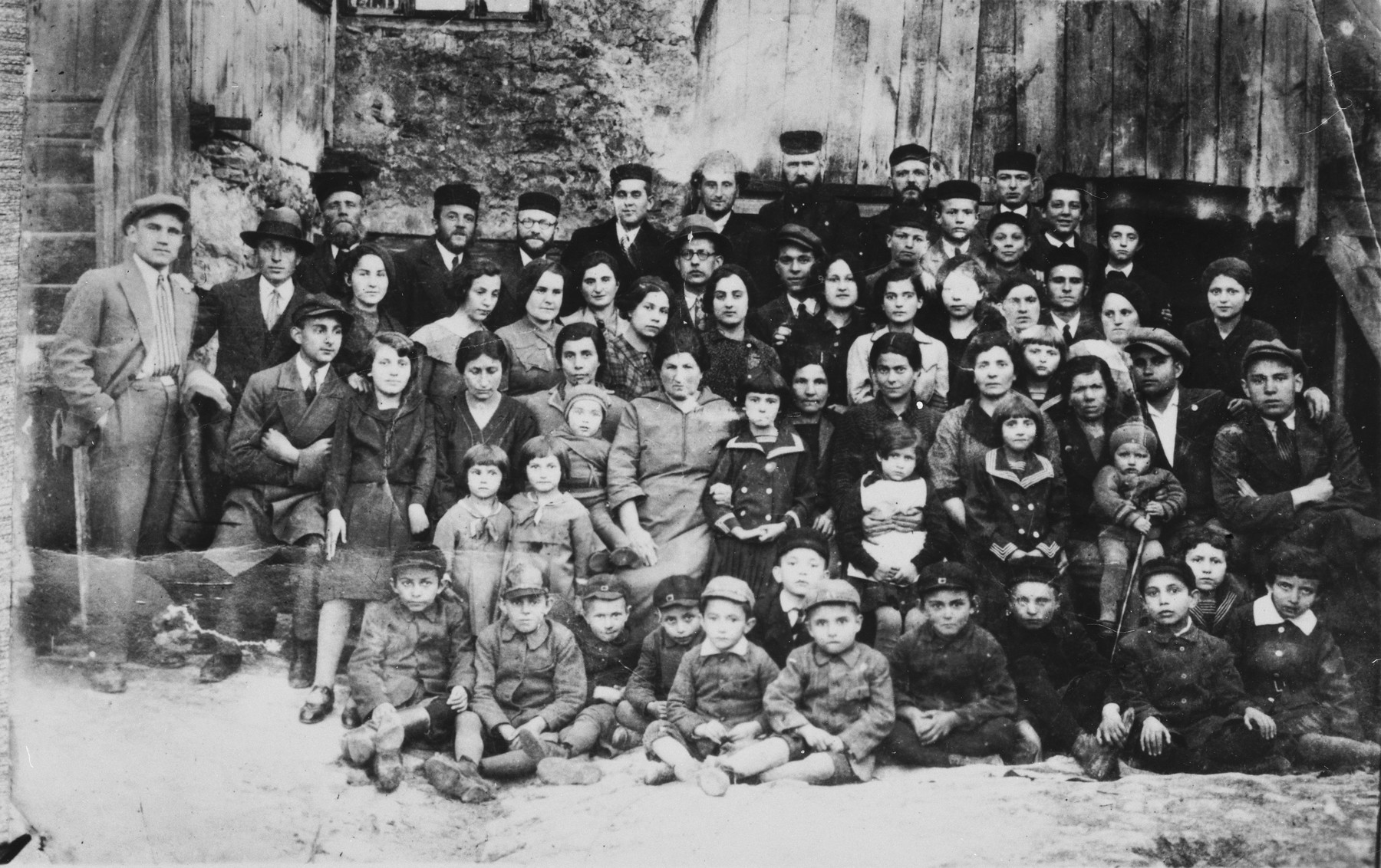 Group portrait of the extended family of Mottle Leichter in Janow Podlaski, Poland.  

The photo was taken on the occasion of the departure of one family member to Palestine.  Only three of those pictured survived the Holocaust, including two who left Poland before the war.