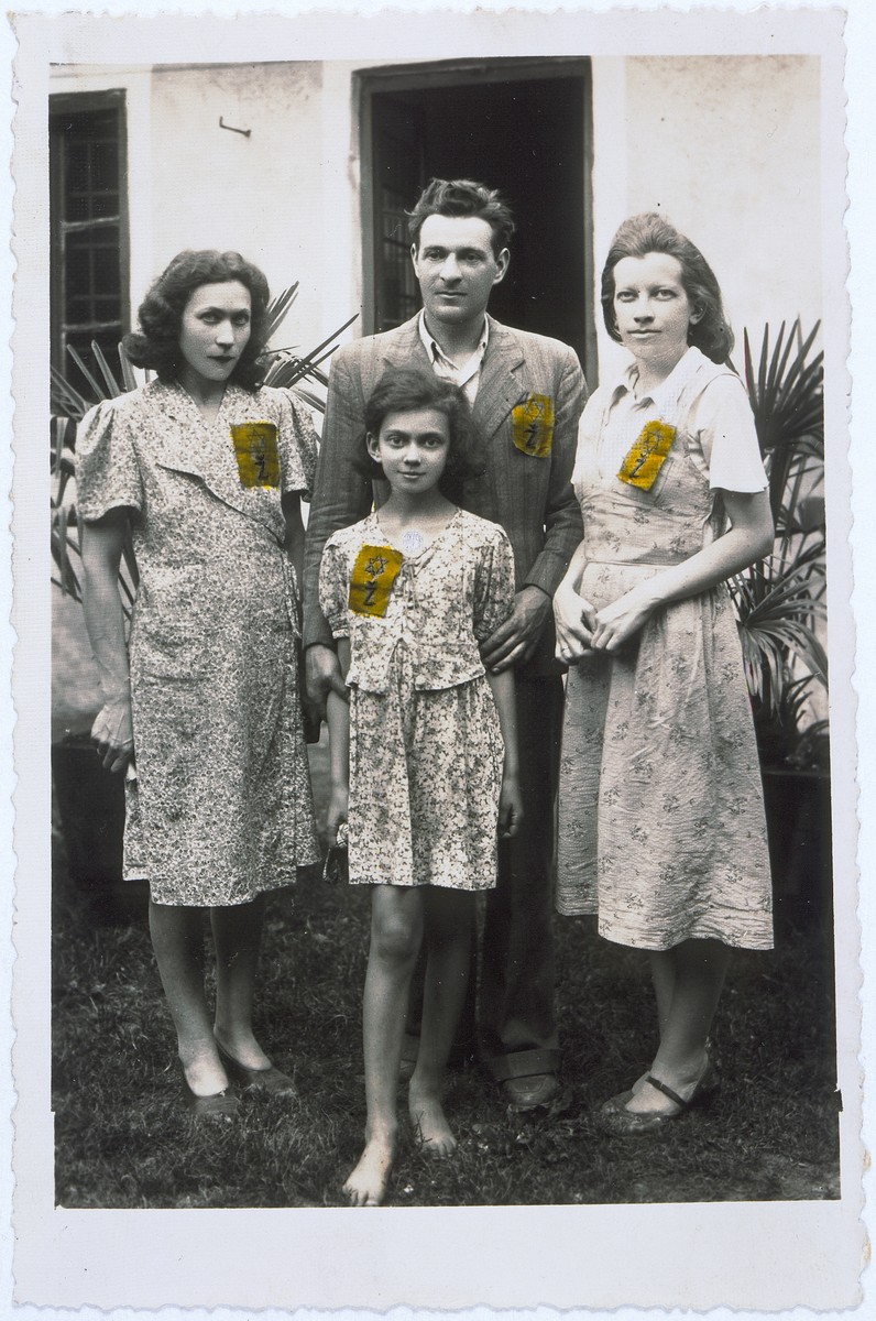 Members of a Jewish family pose outside their home in Zagreb wearing the rectangular, yellow Jewish badges required by the Croatian regime.

Pictured clockwise from the left: are Irma Deutsch, Salamon Basch, Silva (Deutsch) Basch and Edita Deutsch (daughter of Irma).