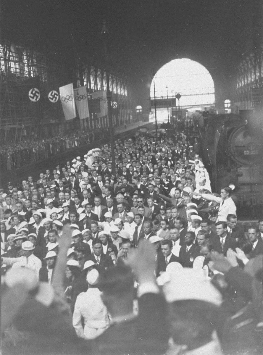 Germans greet the arrival of the U.S. Olympic team in Berlin.