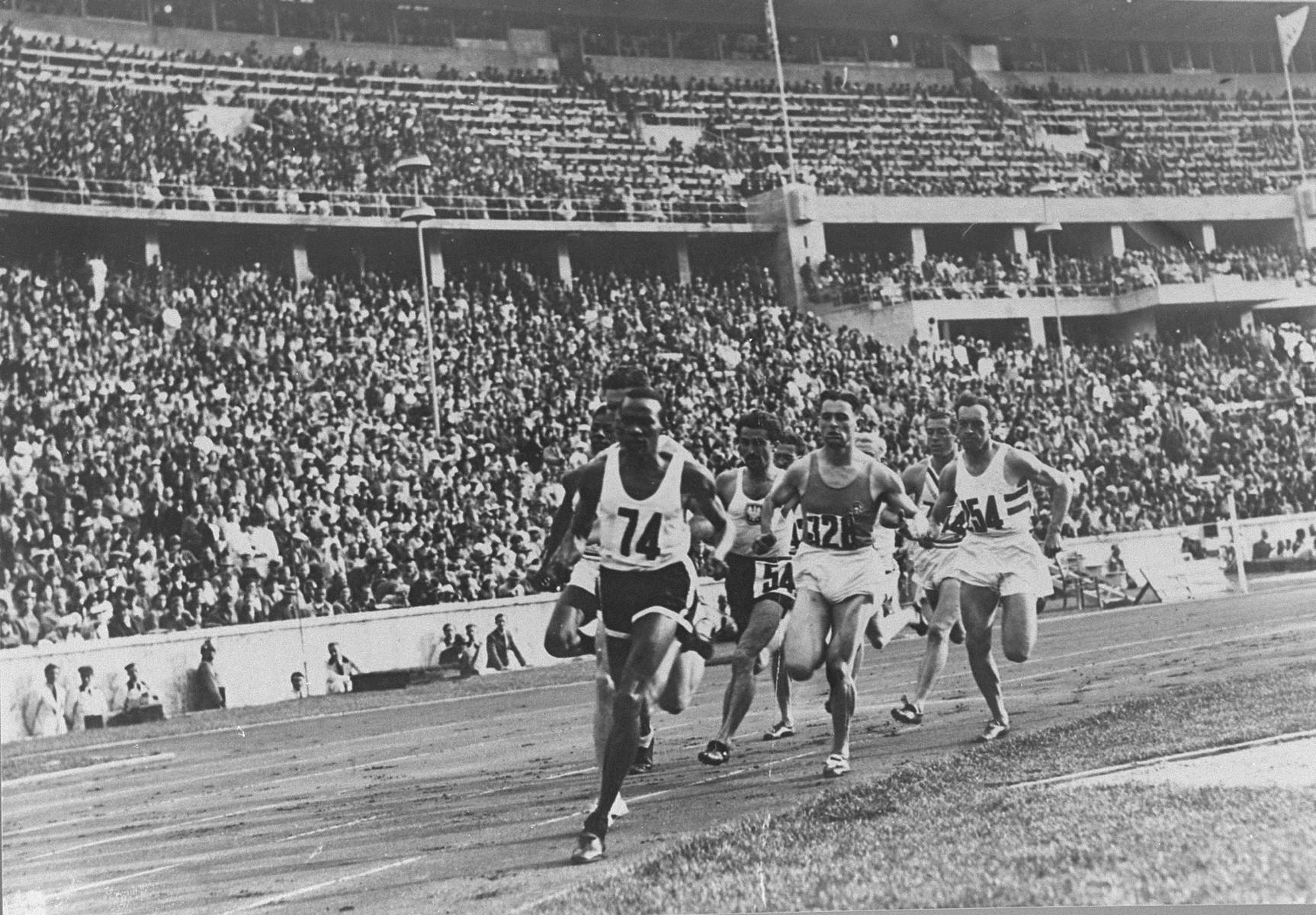 Runners competing in the 800m event at the Olympic games in Berlin.  Barely visible on the outside is American John Woodruff, who came from behind to win the race in 1 minute 52.9 seconds.