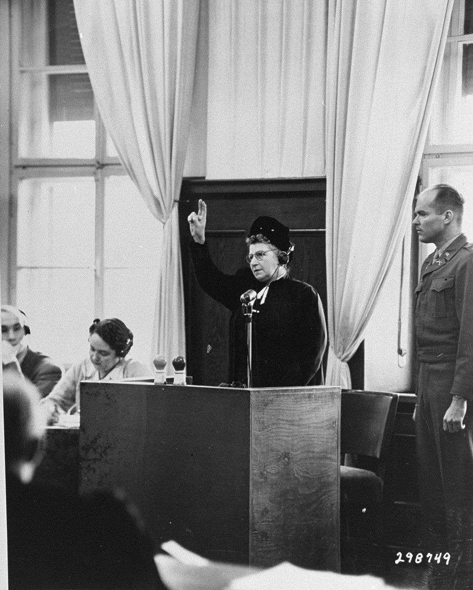 Jeanette Wolf, a Jewish prosecution witness, is sworn in to testify during the Ministries Trial.