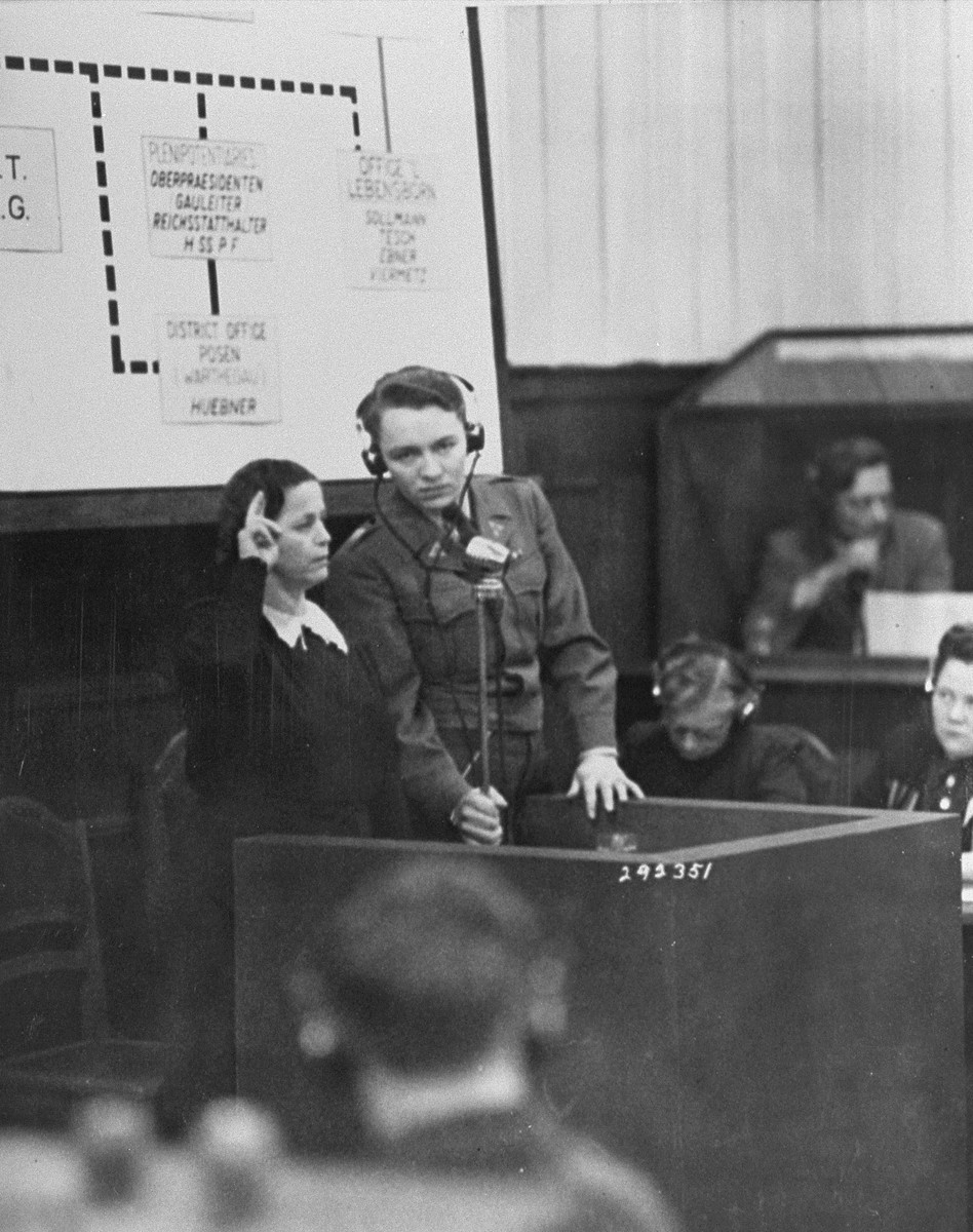 A Czech woman is sworn in as a witness in the RuSHA Trial.  She is testifying about the German massacre of the inhabitants of Lidice, Czechoslovakia.