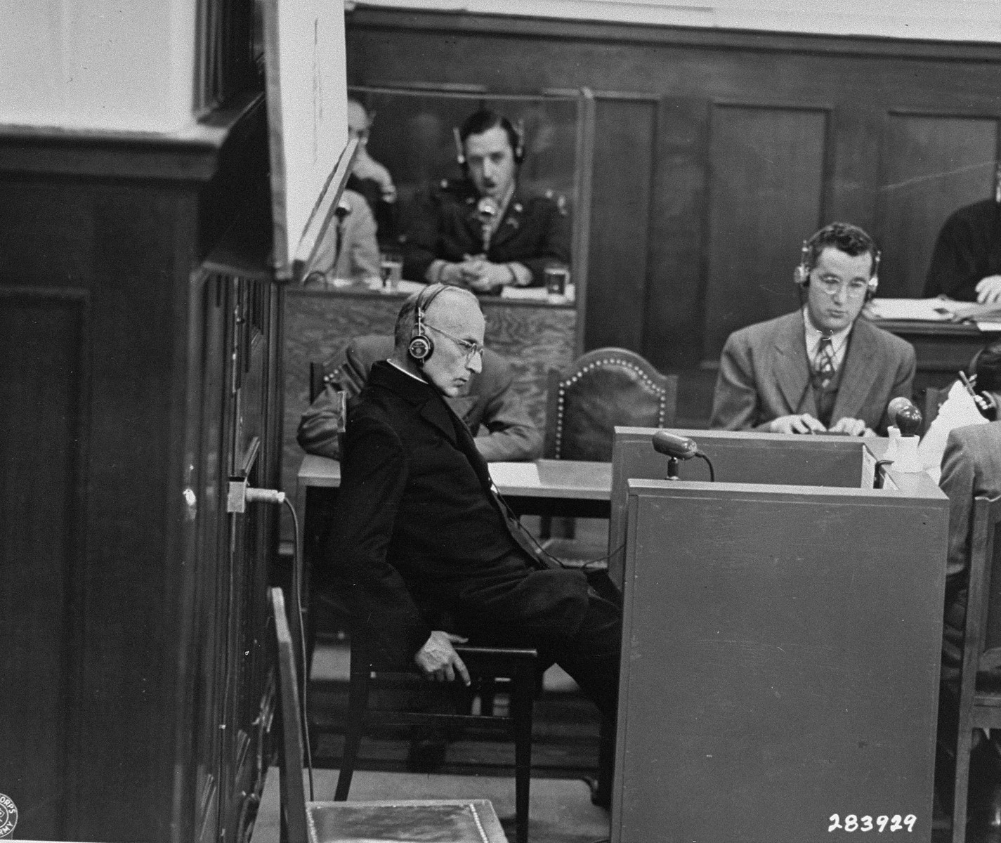 Benedict Wein, a priest from Amberg prison, gives testimony as a witness for the prosecution during the Justice Case.  The testimony took place in a room in the Palace of Justice outside the main courtroom.
