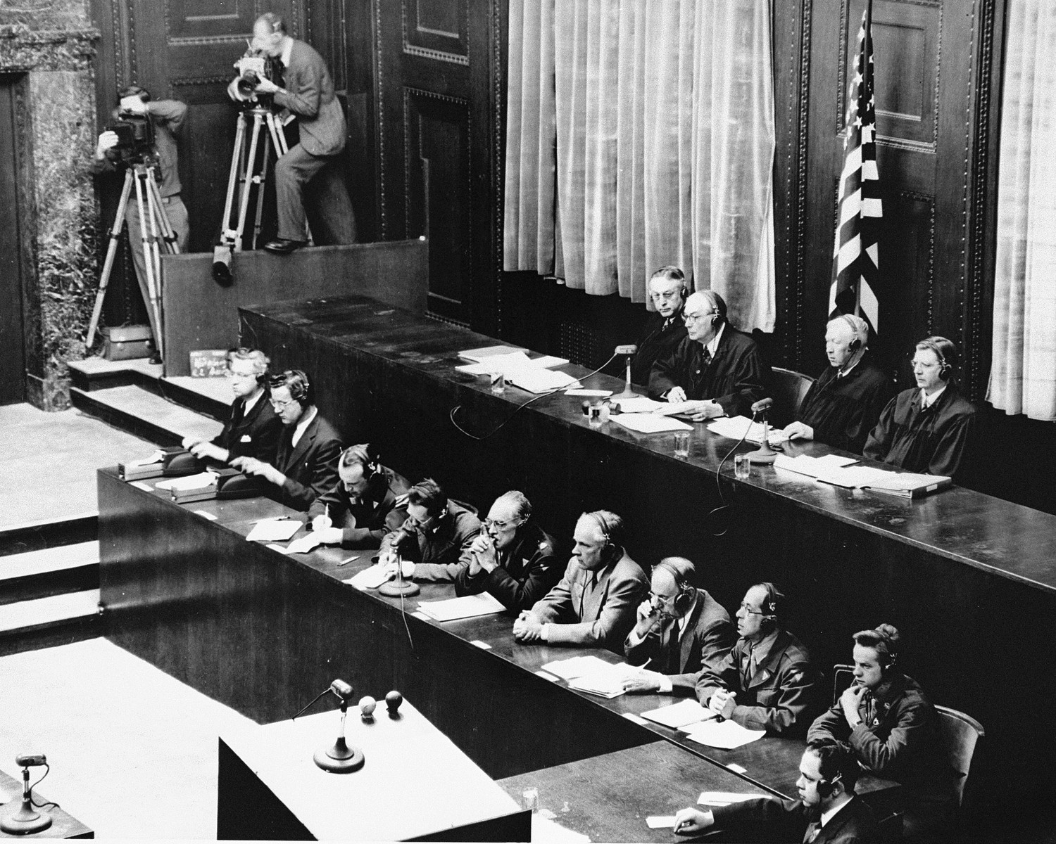 View of the tribunal during a session of the Medical Case (Doctors') Trial in Nuremberg.

In the foreground are the court reporters.