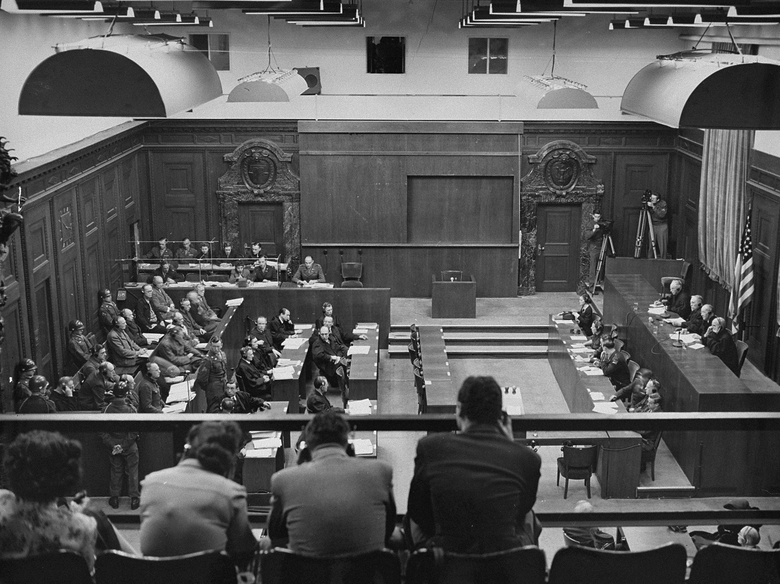 The view from the visitors gallery during the Justice Case.  

From left to right below are the defendants, their lawyers, court reporters, and the Military Tribunal III.