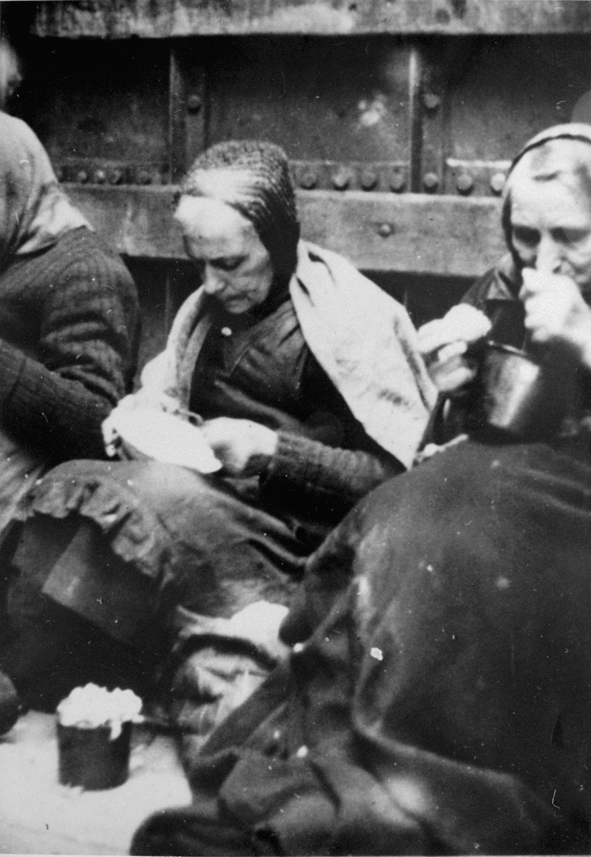 Female prisoners evacuated from the Stutthof concentration camp eat their rations while on board a cargo ship in the Baltic Sea.