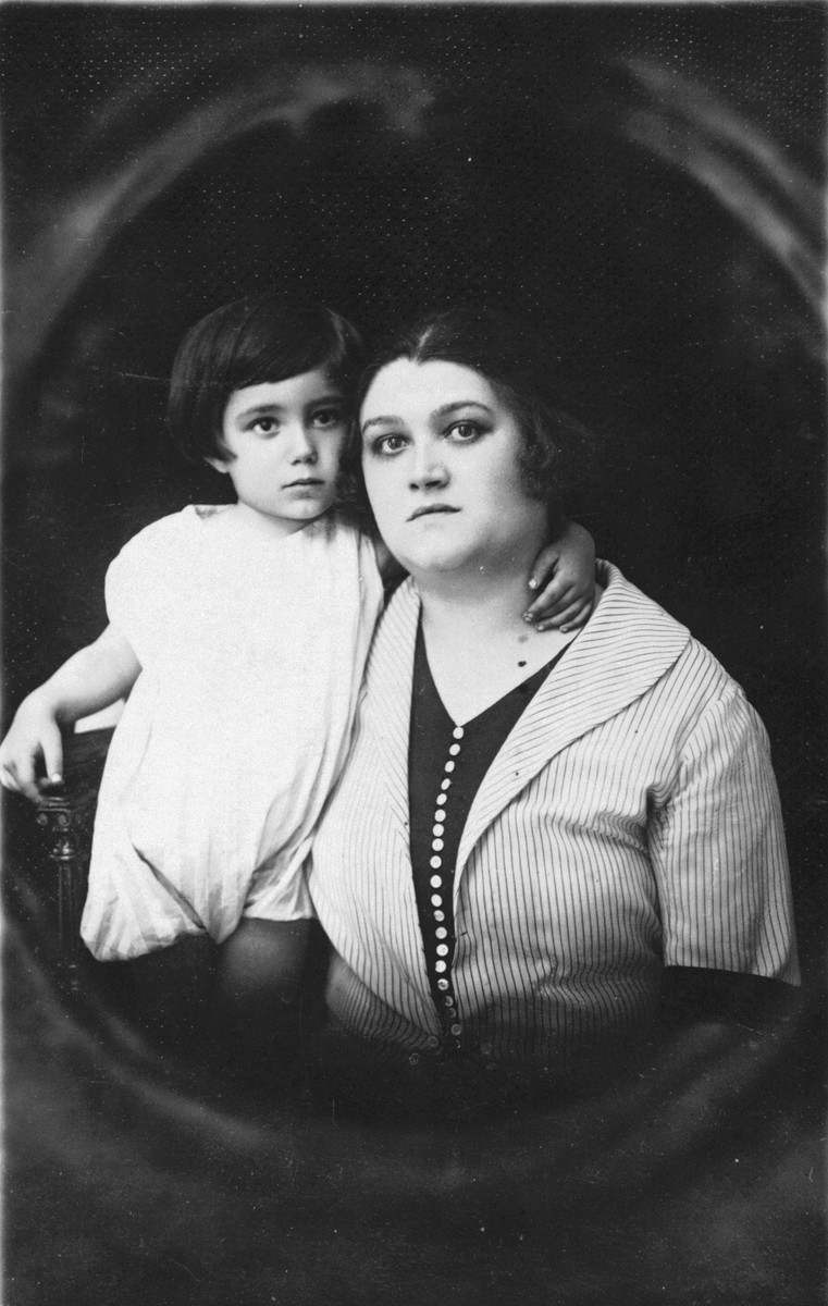Studio portrait of a Jewish mother and son in Mukachevo, Czechoslovakia.

Pictured are Zeni Farbenblum and her son, Rudy.