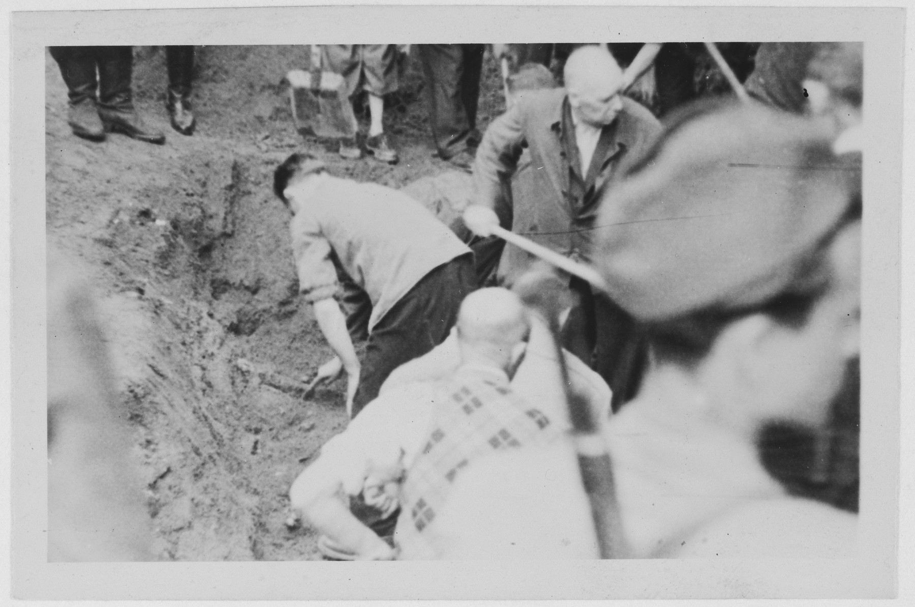 One of a series of photographs depicting the exhumation and reburial of Nazi victims in Pernink, Czechoslovakia.