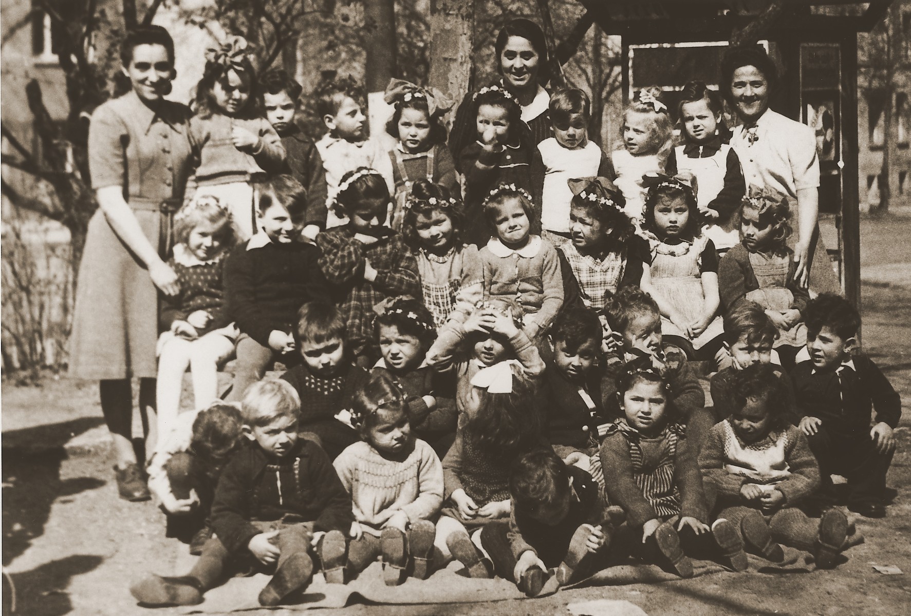 Group portrait of a Kindergarten class at the Stuttgart DP camp.

One image from the Stuttgart Jewish DP camp album entitled, "Jidiszer D.P. Center UNRRA--P.C.IRO in Stuttgart," compiled and photographed by Alexander Fiedel and dedicated to Moses Kornberg, head of the commissary.

Pictured in the middle row far right is Golda Solcer.