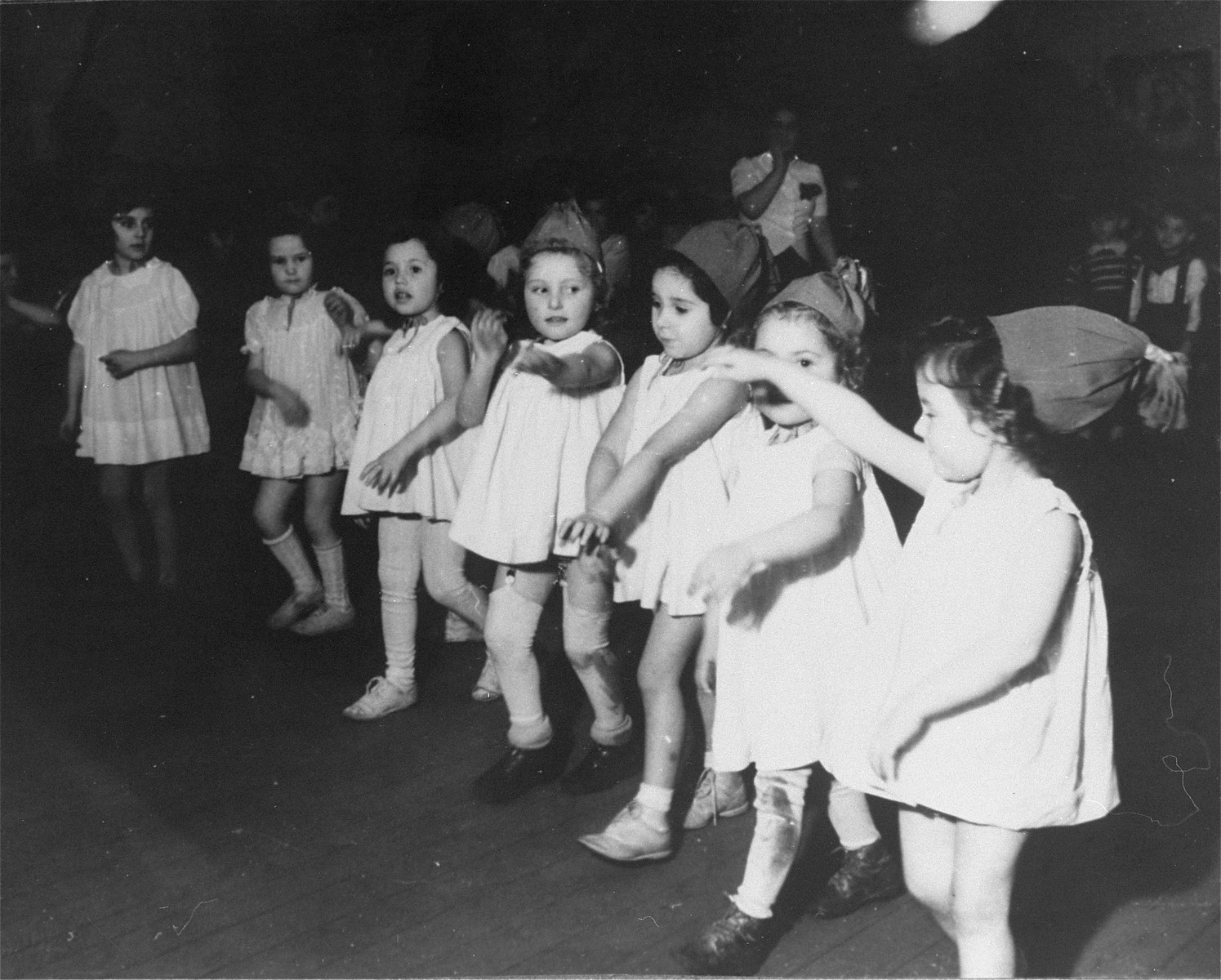 Young children perform a dance in the Zeilsheim displaced persons' camp.
