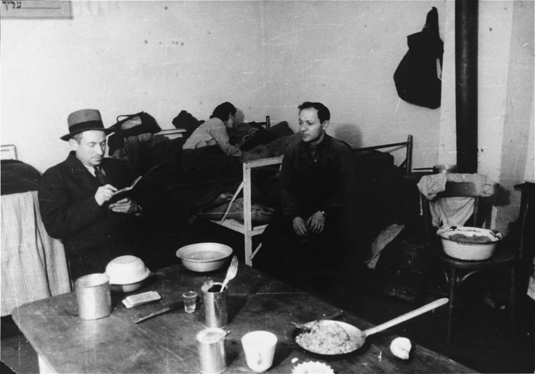 The first refugees to the Zeilsheim displaced persons' camp settle in their sleeping and eating quarters.