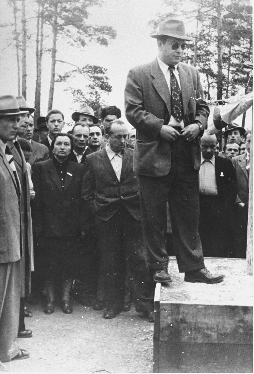Saul Sorrin, director of UNRRA in the Munich area, prepares to deliver a speech at a celebration of the declaration of the State of Israel at the Foehrenwald camp.