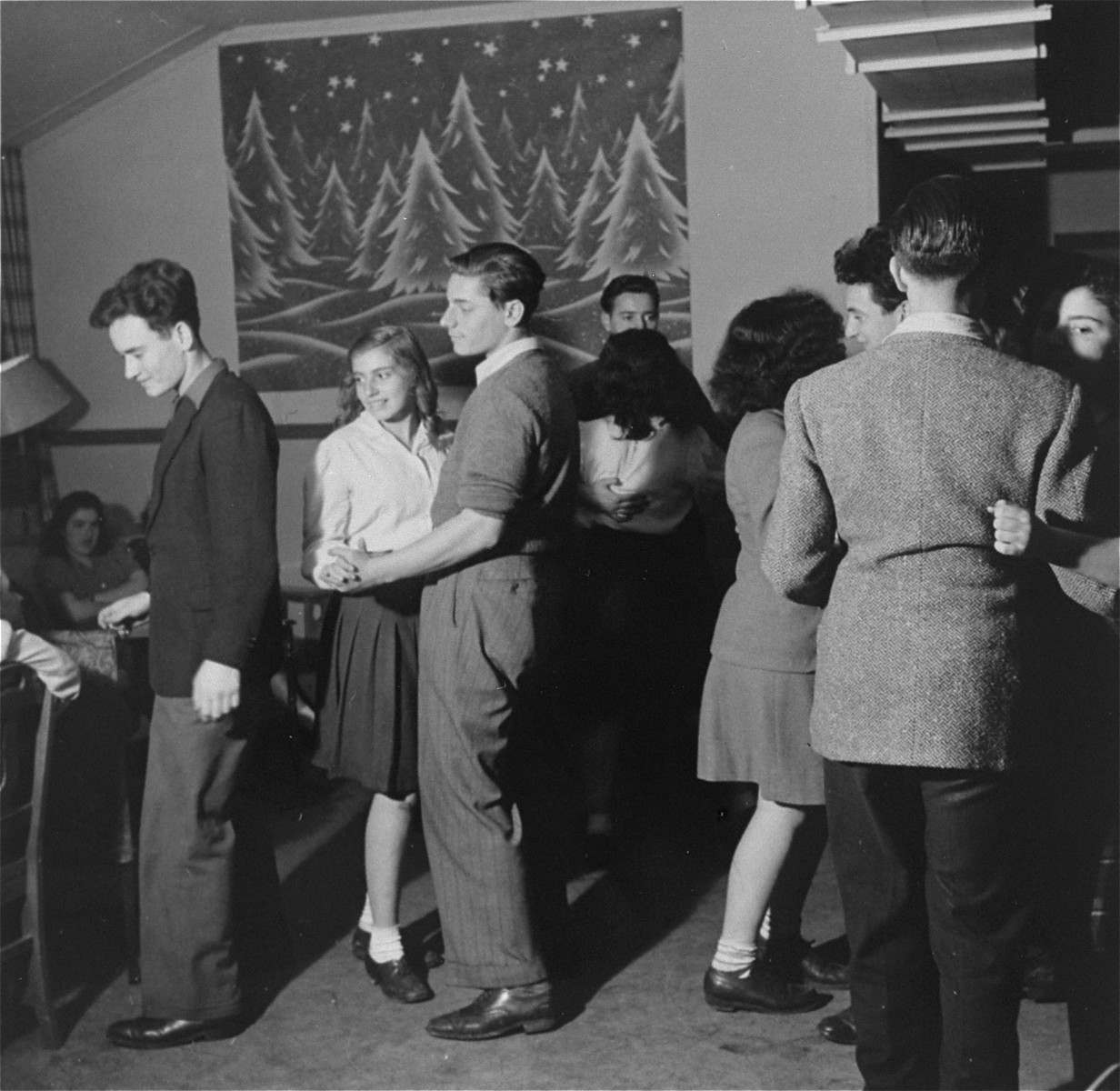 A youth group dance at the Fort Ontario Refugee Center.

Among those pictured left to right are David Hendel, Dorit Reisner, Koki Levi (from Yugoslavia), Adam Munz and [Ivo Lederer].