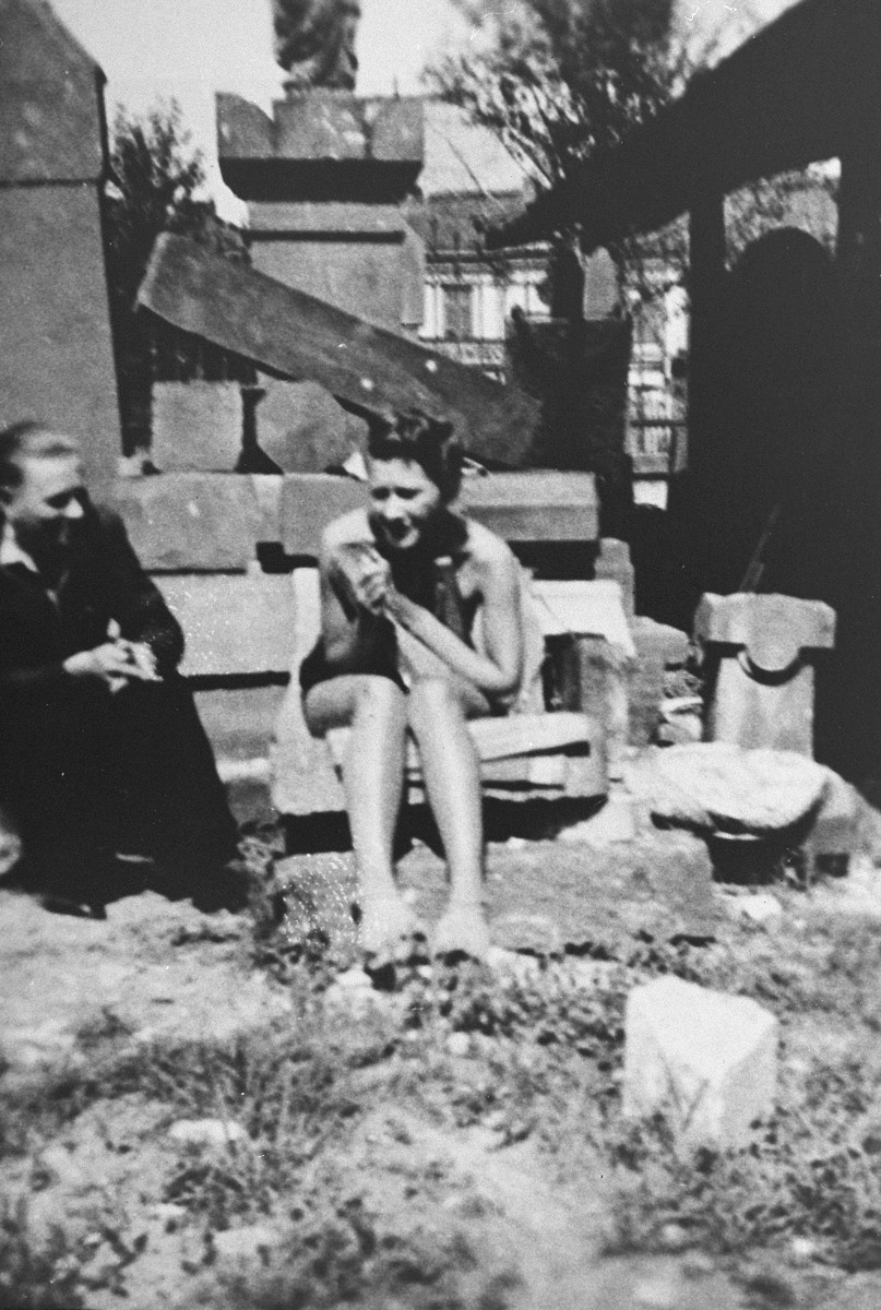 Zofia Baniecka sits outside with a friend.