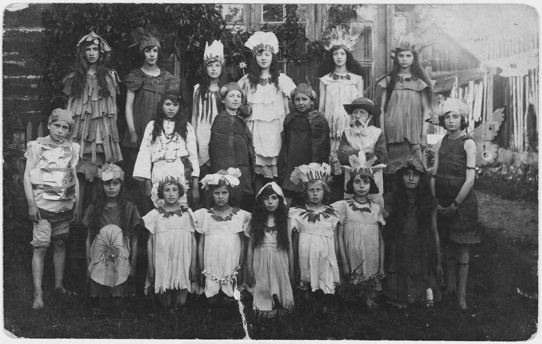 Children in the Yiddish school in Bielsk perform the play, "Among the Flowers".

Genia Kac is standing at the back, fourth from the left.