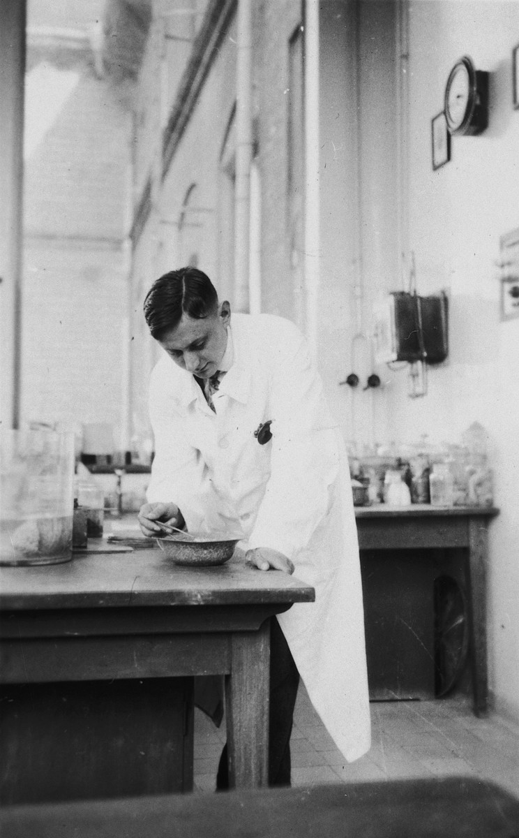 A Jewish physician mixes a medication in his laboratory.

Pictured is Walter Keller.
