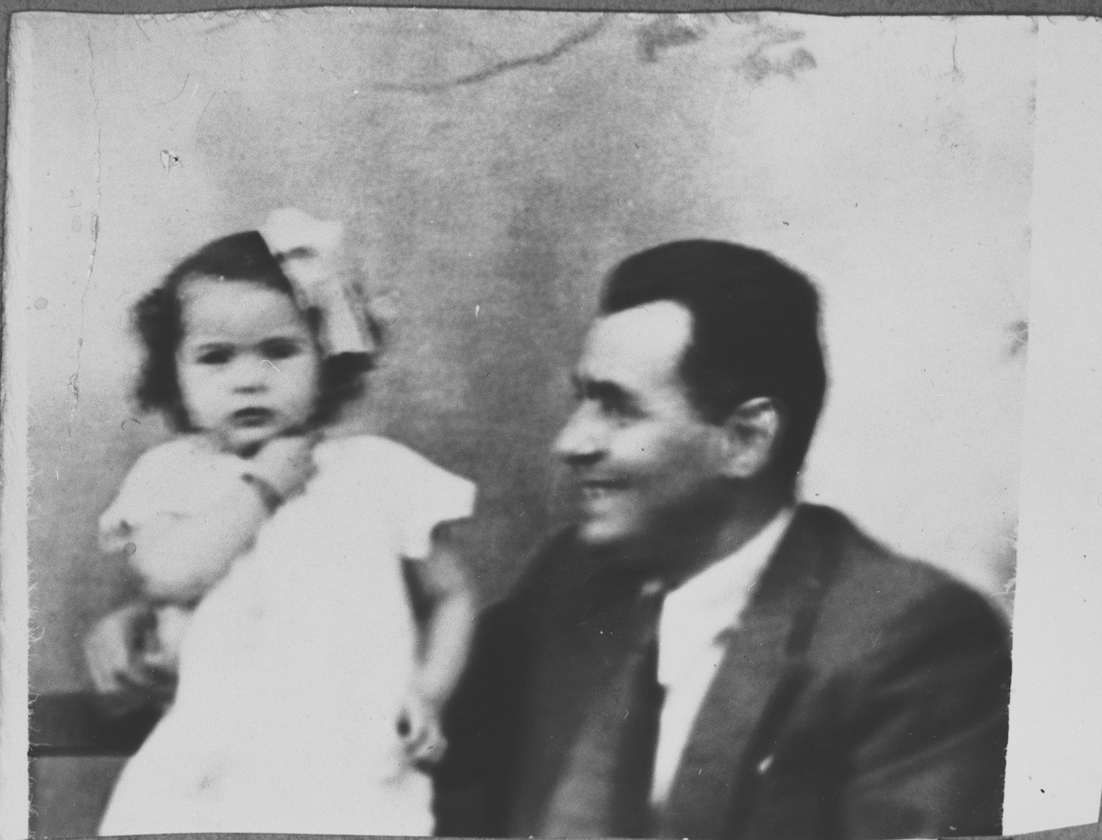 Portrait of Mois Kamchi, son of Solomon Kamchi, with a child.  Mois was an auto dealer.  He lived at Karagoryeva 107 in Bitola.