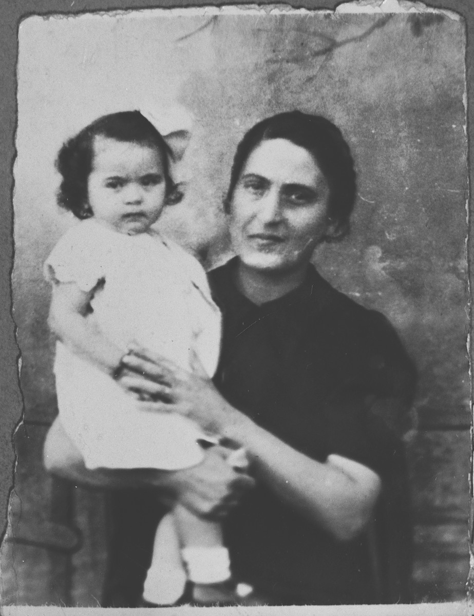 Portrait of Luna Kamchi, wife of Mois Kamchi, with a child.  She lived at Karagoryeva 107 in Bitola.