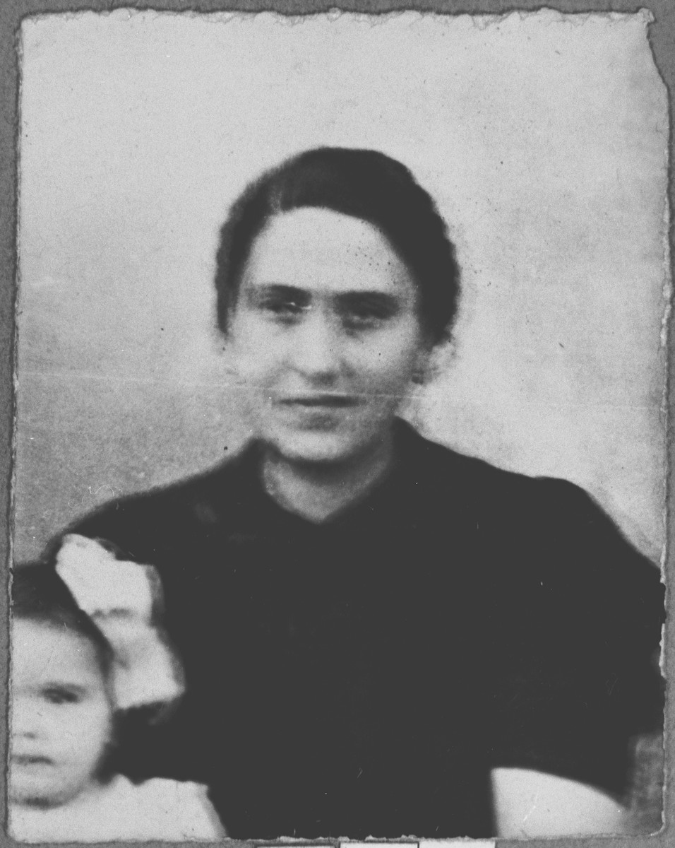 Portrait of Luna Kamchi, wife of Mois Kamchi, with a child.  She lived at Karagoryeva 107 in Bitola.