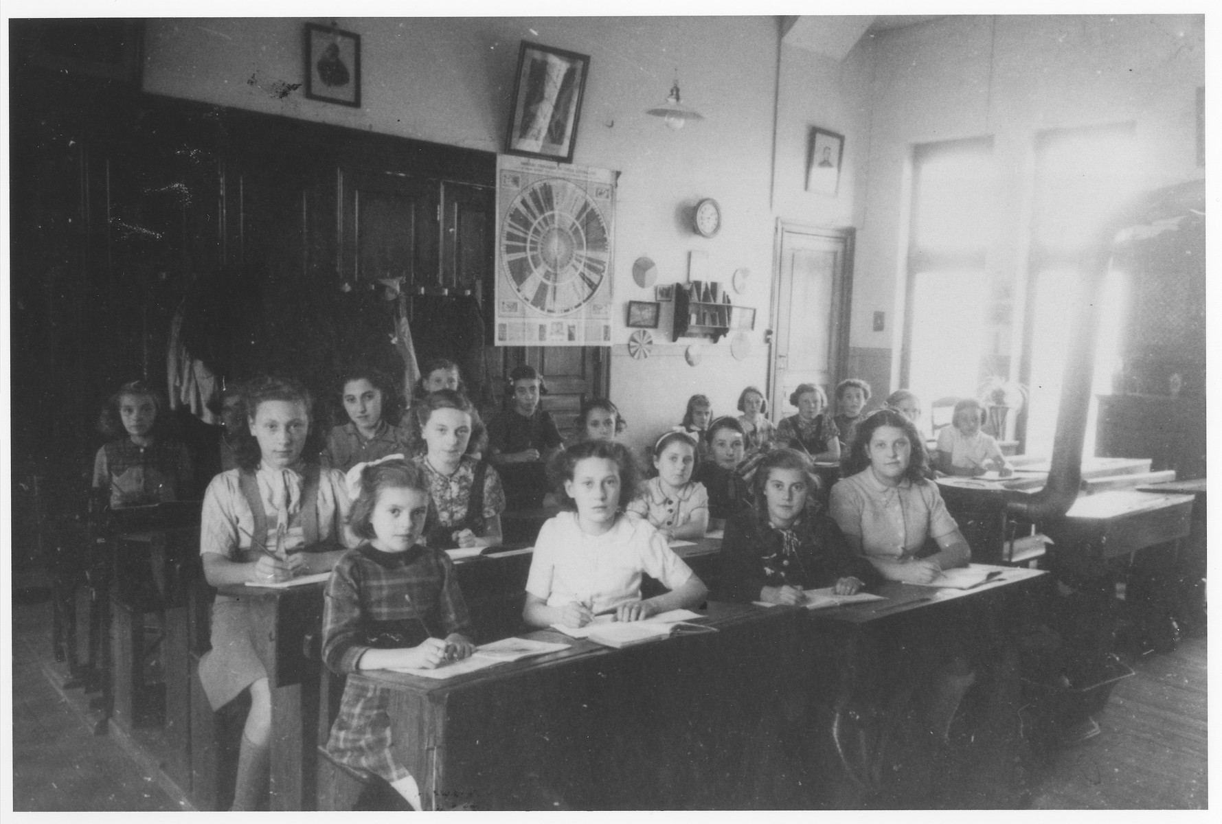 Jewish girls who are living in hiding, study alongside Catholic students at the Soeurs de Sainte Marie convent school near Braine-l'Alleud.

Ursula Klipstein is seated in the first row on the far right.