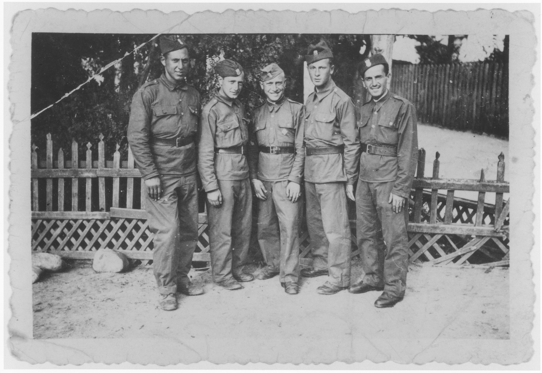 Group portrait of five Jewish soldiers serving in the Polish army.

Among those pictured is the brother of Abe Lajbman (second from the right).