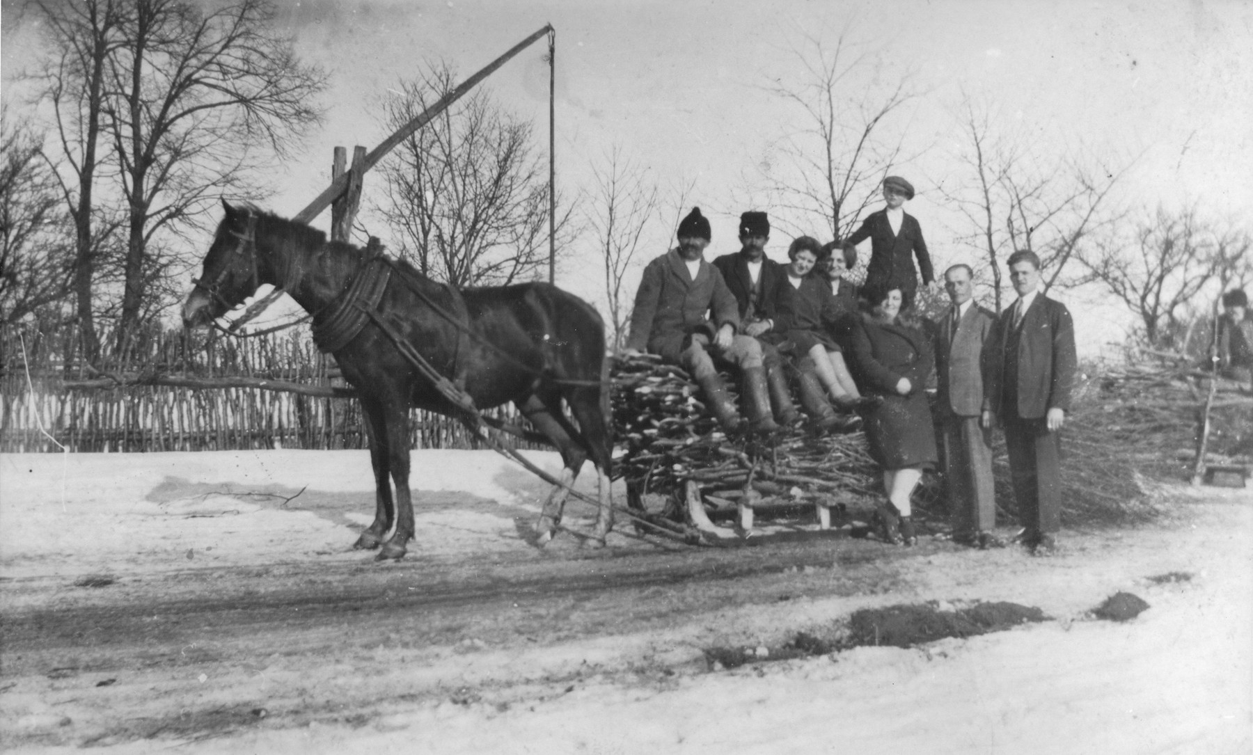 The Gurfein family poses on a horse-drawn sleigh while on vacation in Raczyna, Poland.

Among those pictured is Basia Gurfein (front).