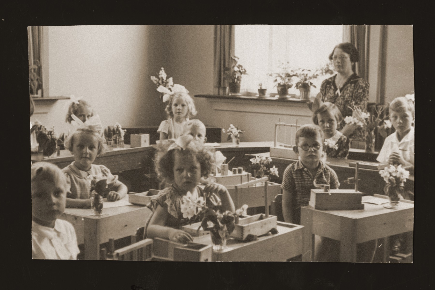 Rachel Kats (front row center) sits in her kindergarten class with other Jewish and non-Jewish children.