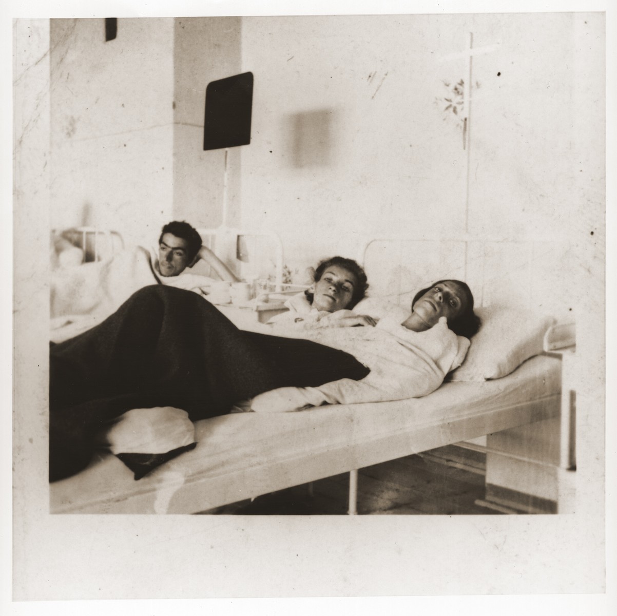 Three Jewish women in a hospital provided by American troops.  The women are survivors of a death march from Helmbrechts that ended in Volary.

Among those pictured is Rozia Epsztajn (center).