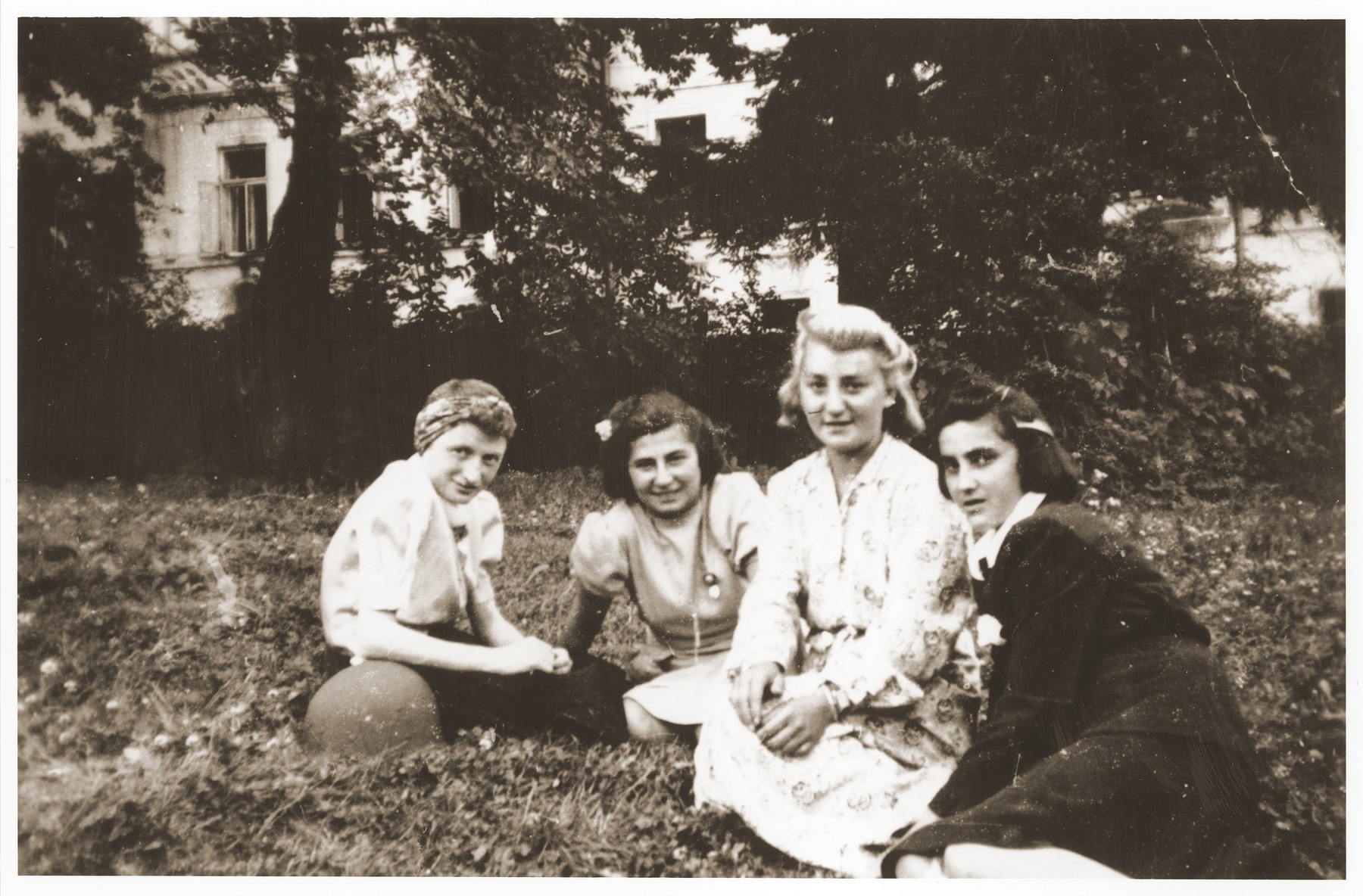 Four survivors of the 500 kilometer. death march that ended in Volary.  These Jewish survivors are recuperating in Prachatice, near Volary.  

Pictured from left to right are: Hela Malnowicer Bleeman, Helina Goldberg Kleiner, unknown, and Lilka Haber Silbiger.