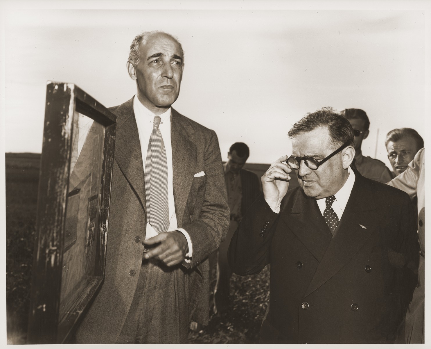 UNRRA Director General Fiorello LaGuardia and U.S. Ambassador to Czechoslovakia, Laurence Steinhardt pay an official visit to the site of the Nazi massacre of Czech civilians in Lidice that was perpetrated in June 1942 in retaliation for the assassination of Reinhard Heydrich, then Reichsprotektor of the Protectorate of Bohemia and Moravia.