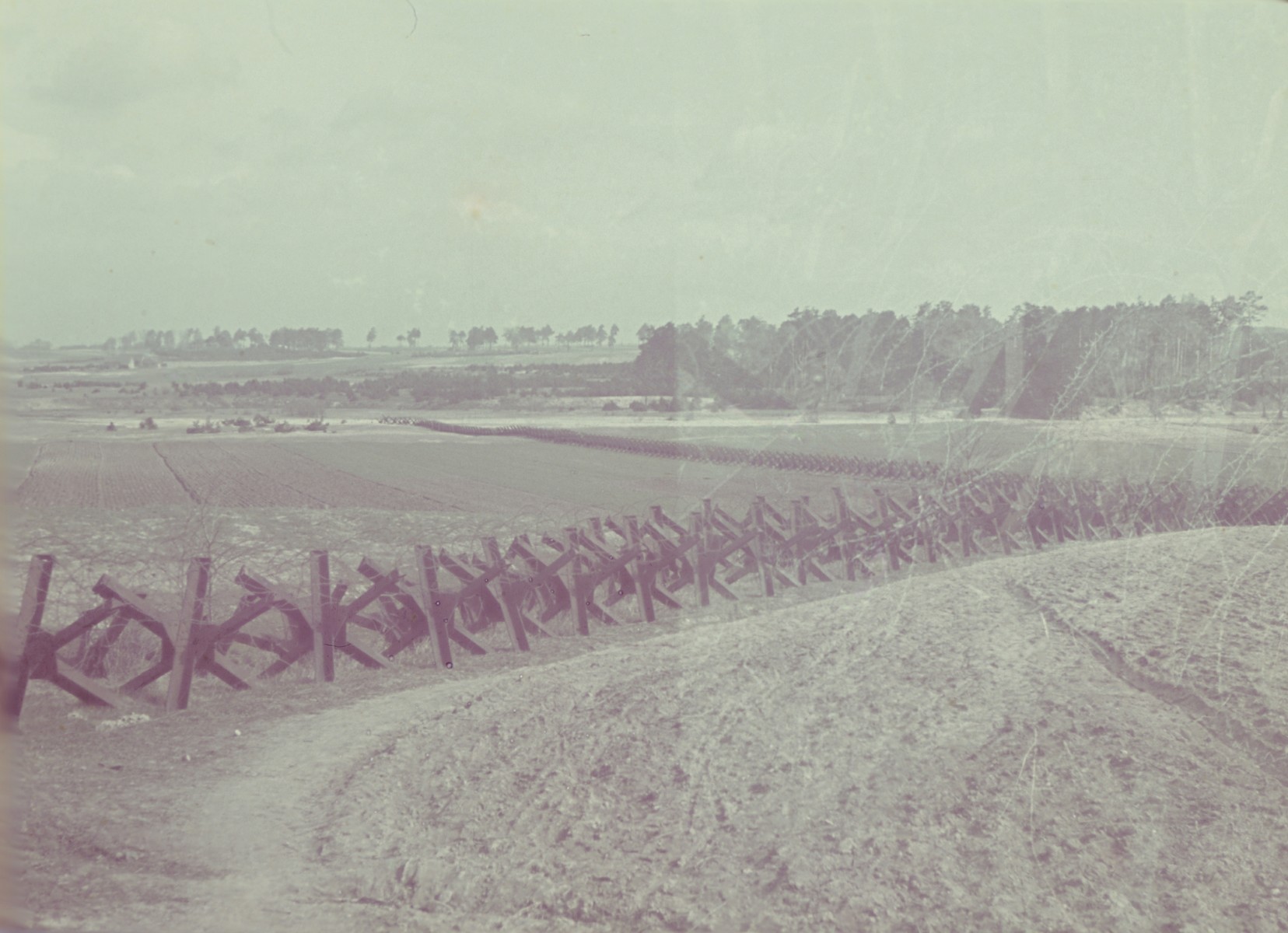 View of a fenced in field near Lublin from the Genewein collection.