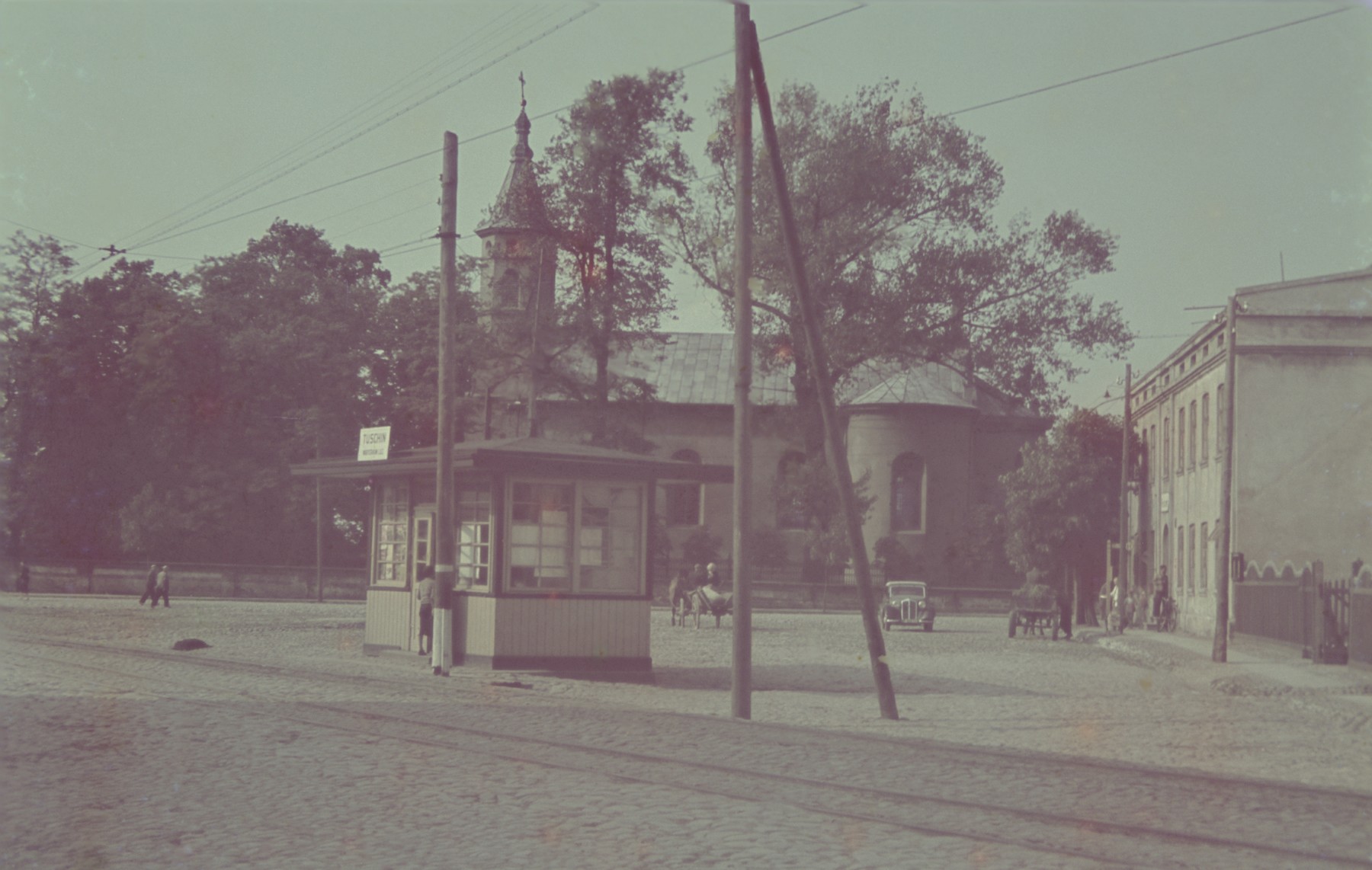 A street scene in Tuszyn.

Original German caption: "Tuschyn", #111.