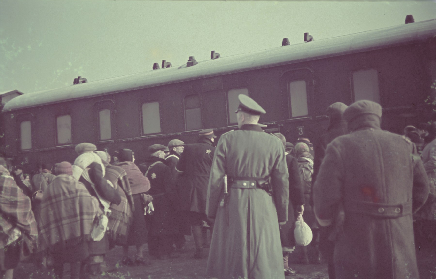 Deportation of Jews from the Lodz ghetto to the Chelmno death camp.

Original German caption: "Judenausseidlung" (Jewish resettlement), April 1942, #135.