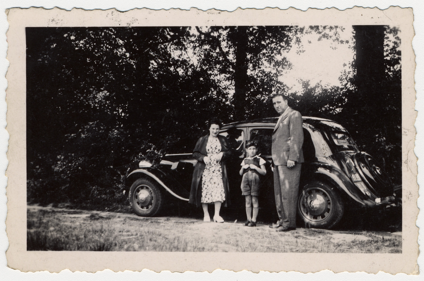 Steven Simon in middle with his parents, Irma Rachel Simon and Arthur Simon, next to their family car on vacation in 1939 prior to WW II.

The French army requisitioned the automobile as soon as the war broke out.