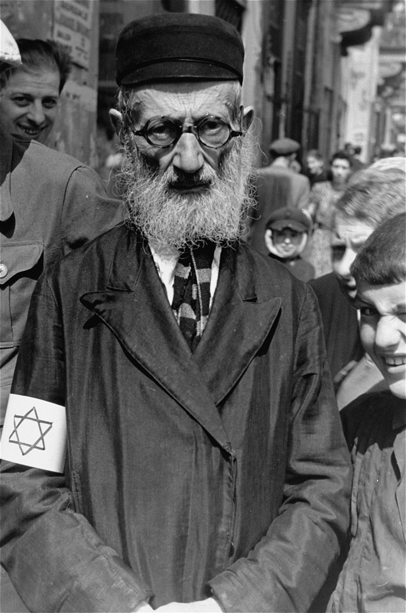 Portrait of an elderly, bearded Jew on the street in the Warsaw ghetto.