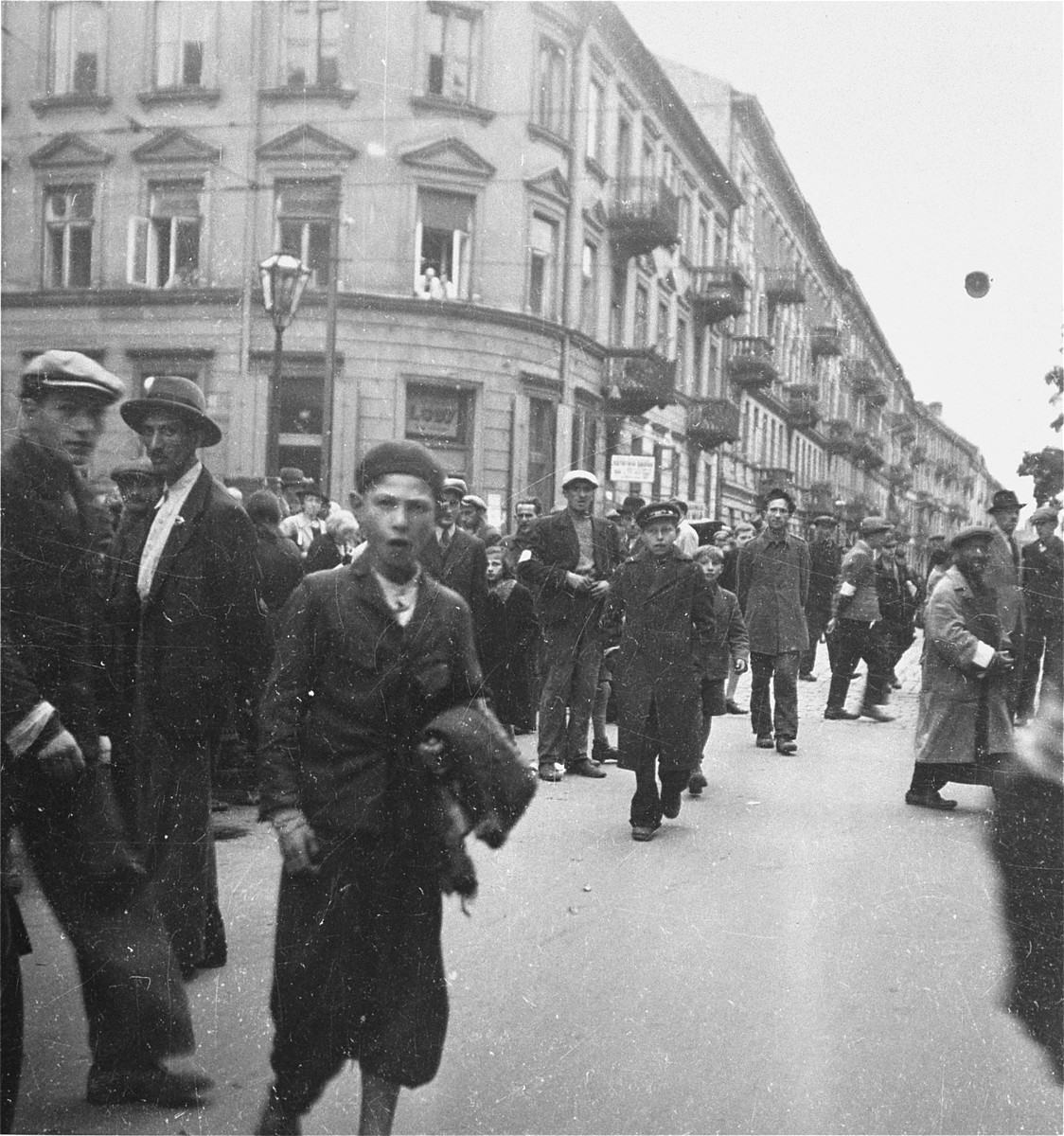 Jews on the street at a major intersection in the Warsaw ghetto.  

Joest's caption reads: "What should I say about this?  People upon people on the street.  I could not imagine at that time where they should all go."
