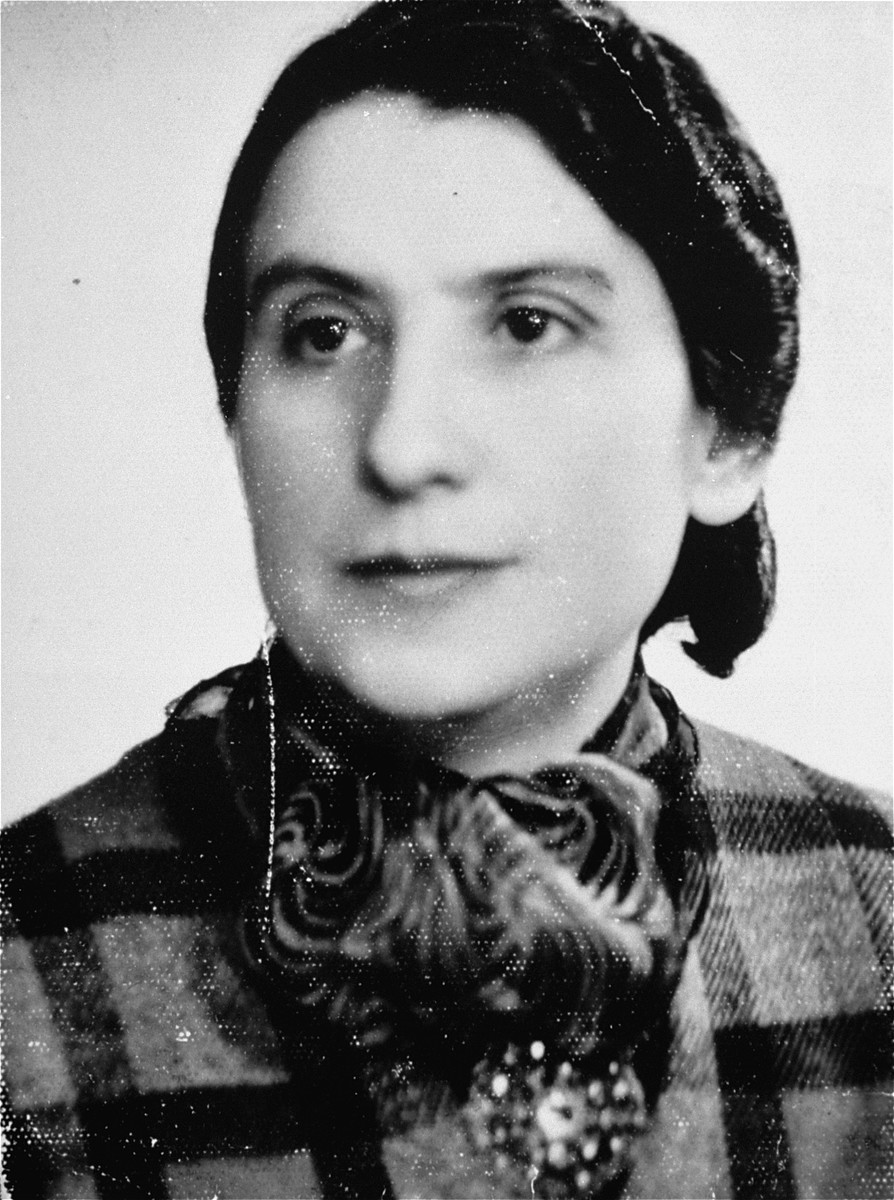 A portrait of Frymet Kramarska, the donor's mother. This portrait was taken for an identification card while Mrs. Kramarska was in the ghetto. She was deported to Treblinka in 1942.